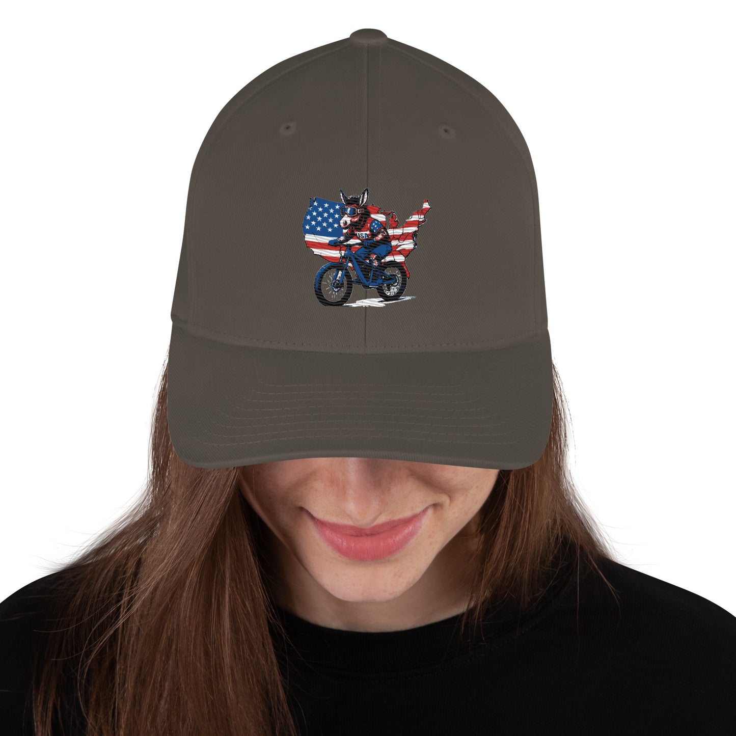 Person wearing a cap with a graphic of a person on a motorcycle and an American flag design.