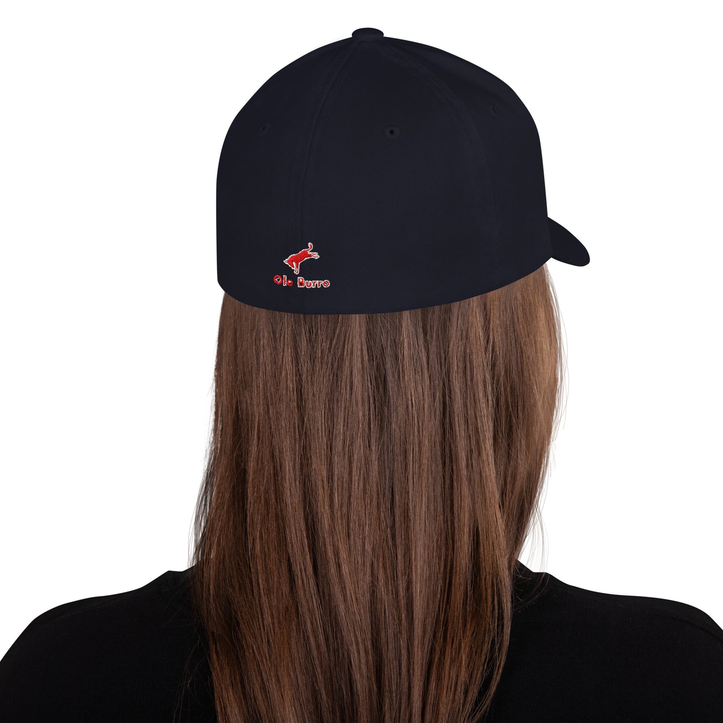 Black cap with a logo worn by a person with long brown hair on a white background