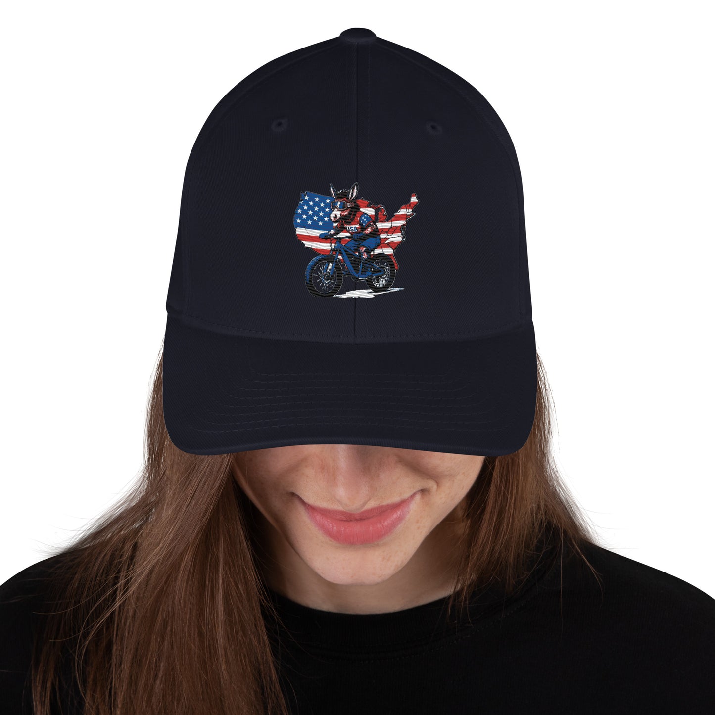 Black cap with a graphic design of a person on a motorcycle and an American flag, worn by a person.