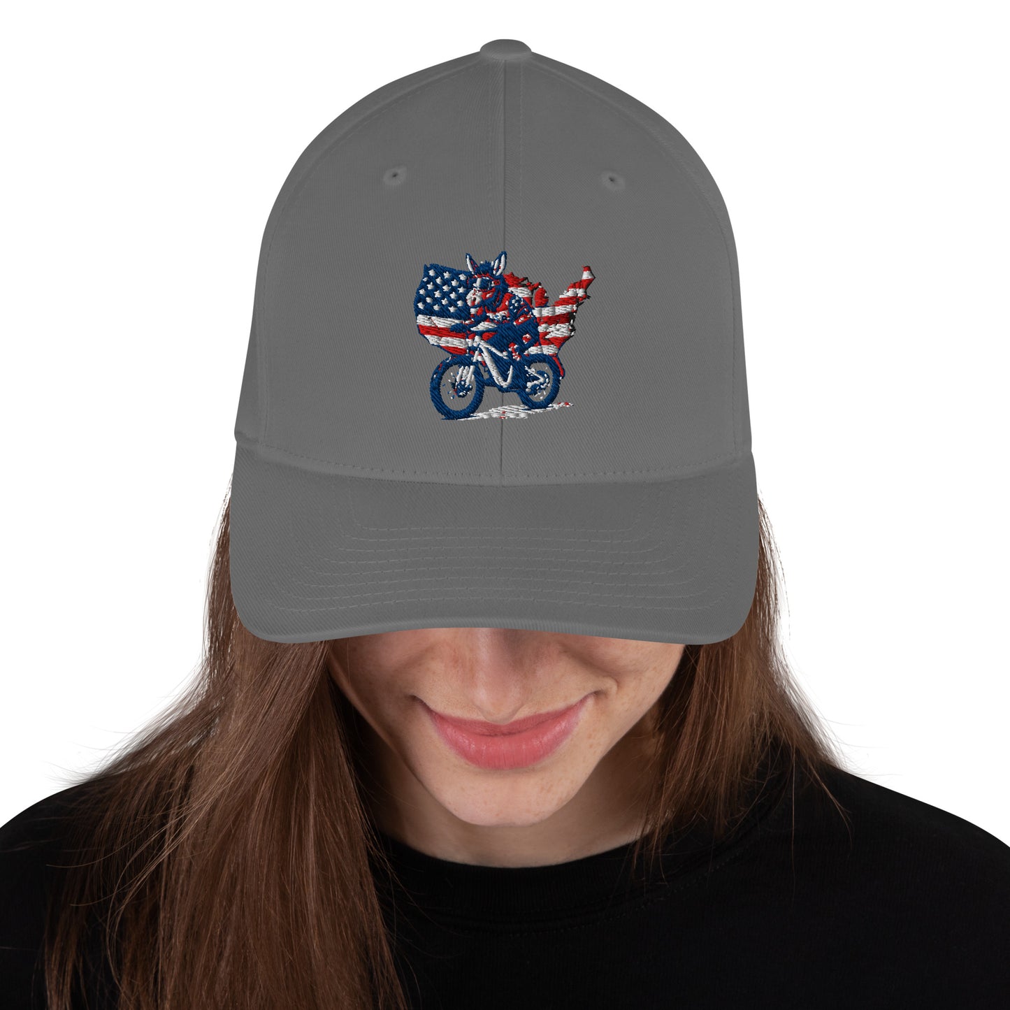 Gray cap with American flag and motorcycle design worn by a person on a white background