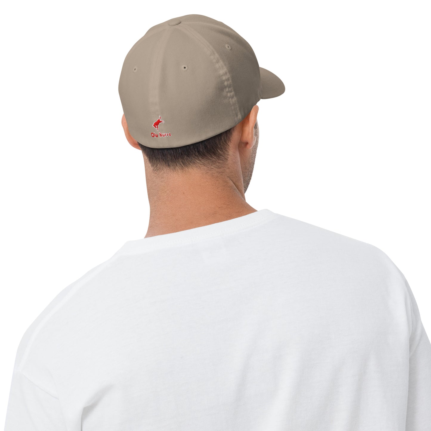 Person wearing a beige cap with a logo on the back, facing away from the camera.