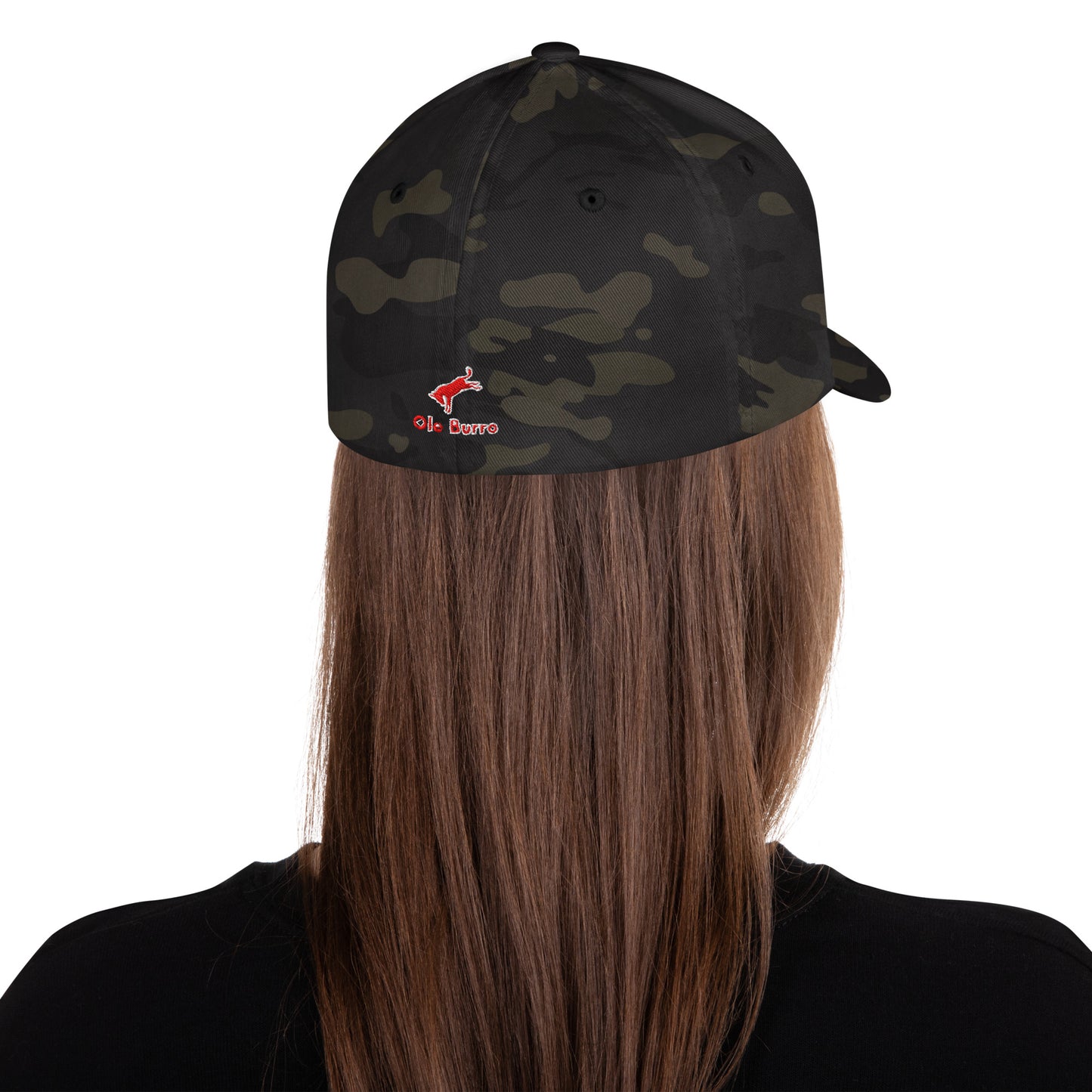 Person wearing a black camouflage cap with a logo on a white background