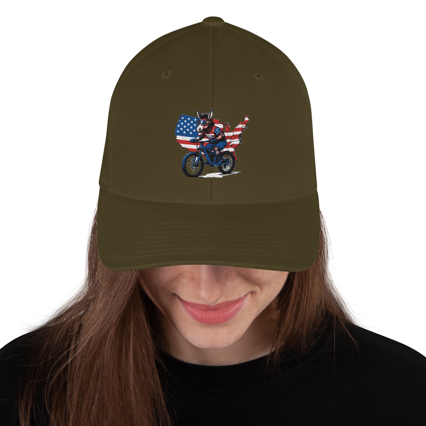 Person wearing a green cap with a graphic of a person on a motorcycle and an American flag.