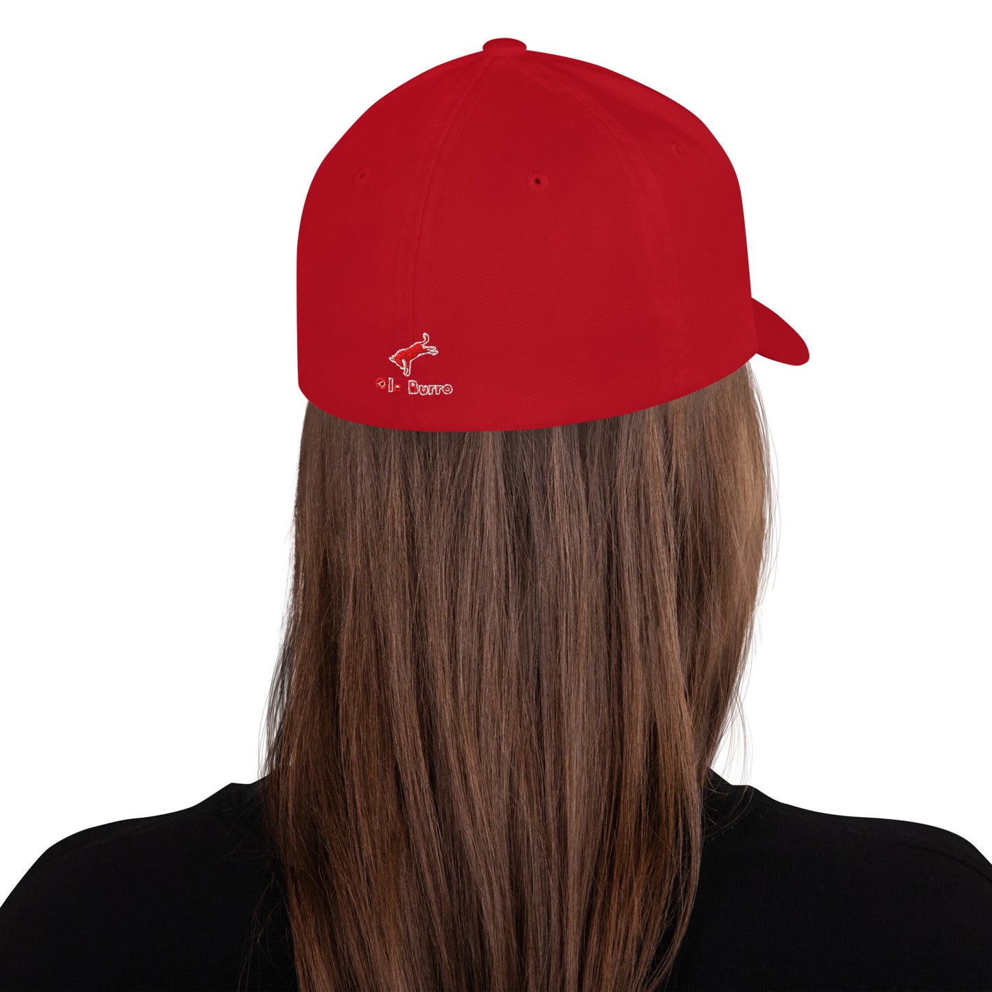 Red cap with a logo worn by a person with long hair on a white background