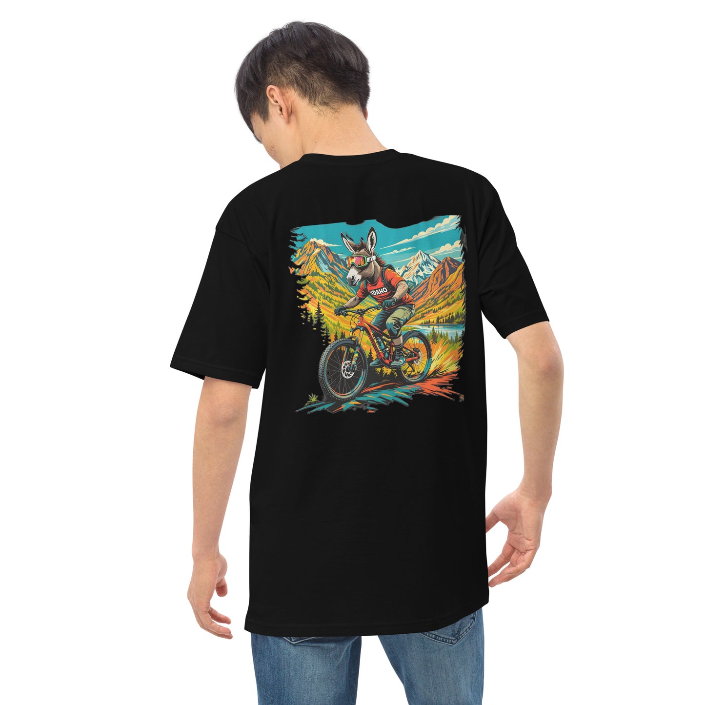 Person wearing a black t-shirt with a colorful graphic on the back, standing against a white background