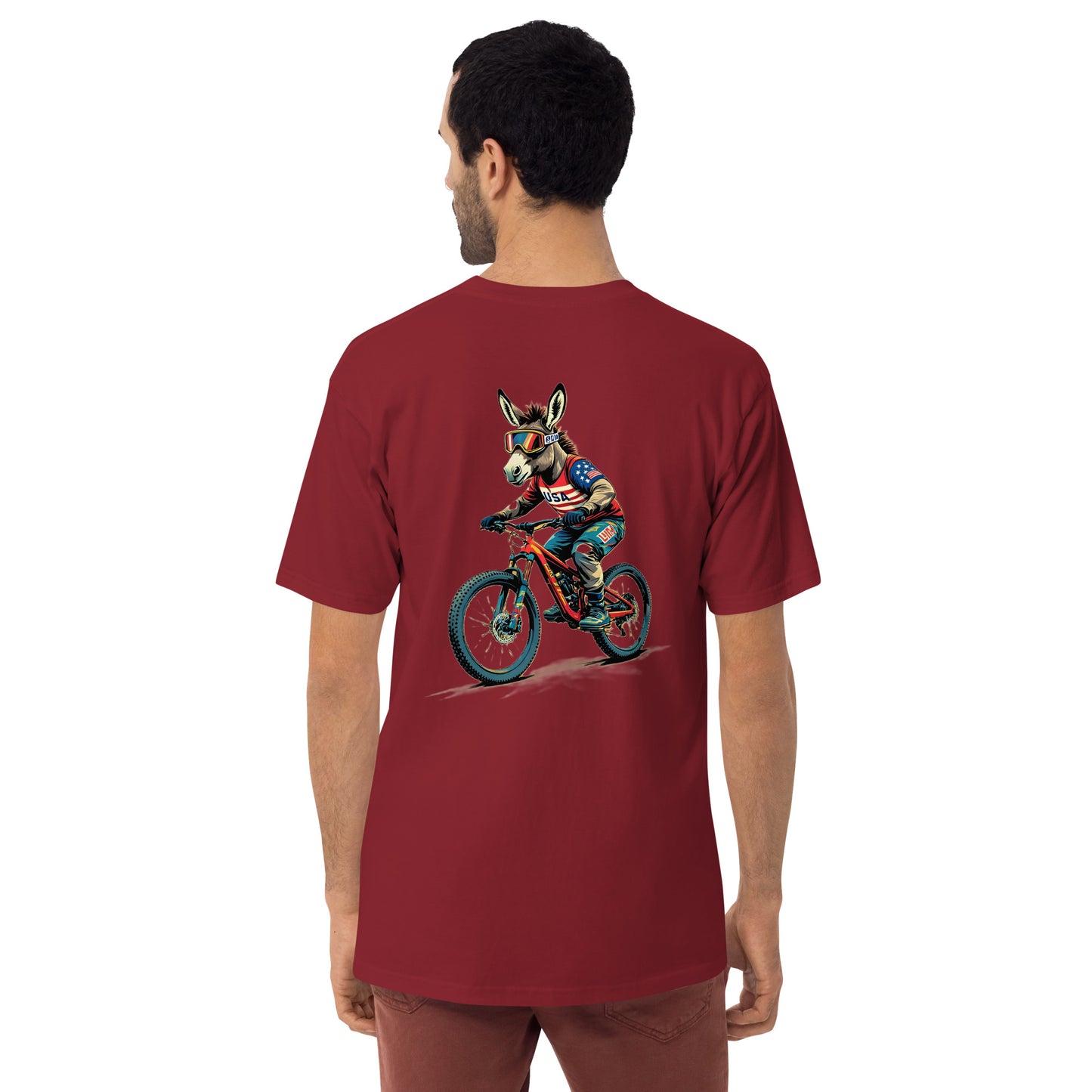 Man wearing a red t-shirt with a graphic of a donkey riding a bike on the back.