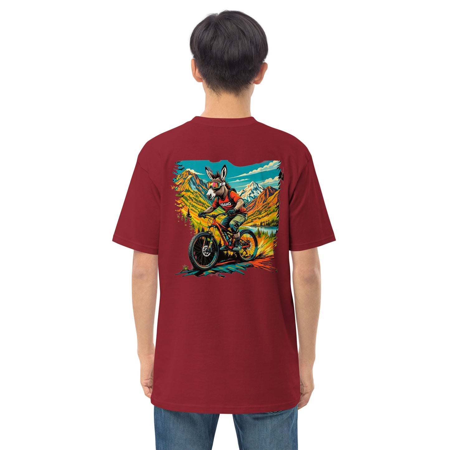 Person wearing a maroon t-shirt with a colorful graphic on the back