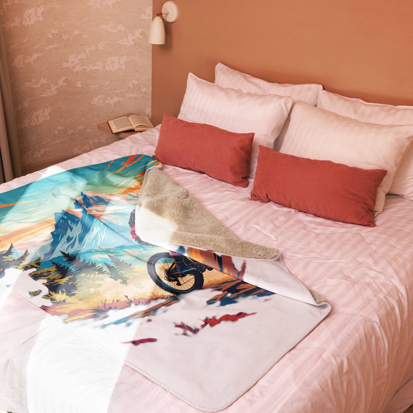 Colorful mountain-themed blanket on a bed with pillows