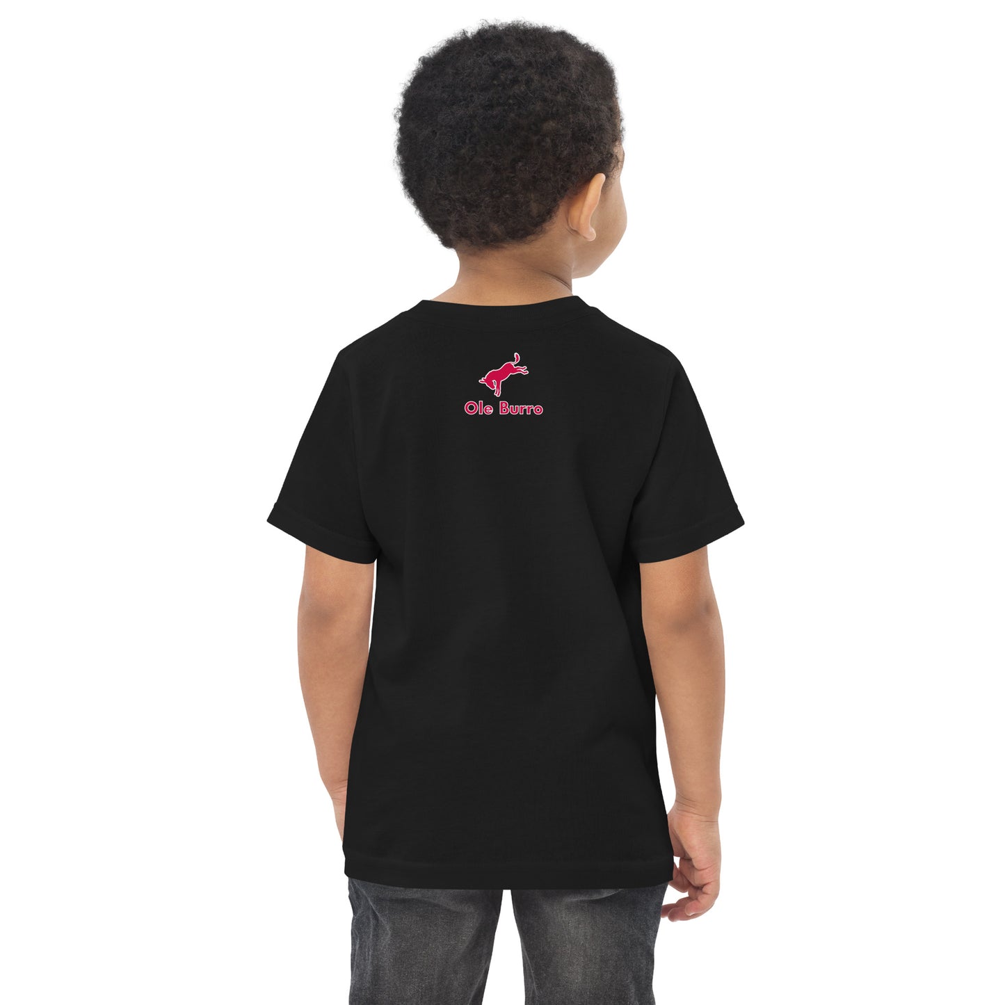 Child wearing a black t-shirt with a logo on the back against a white background