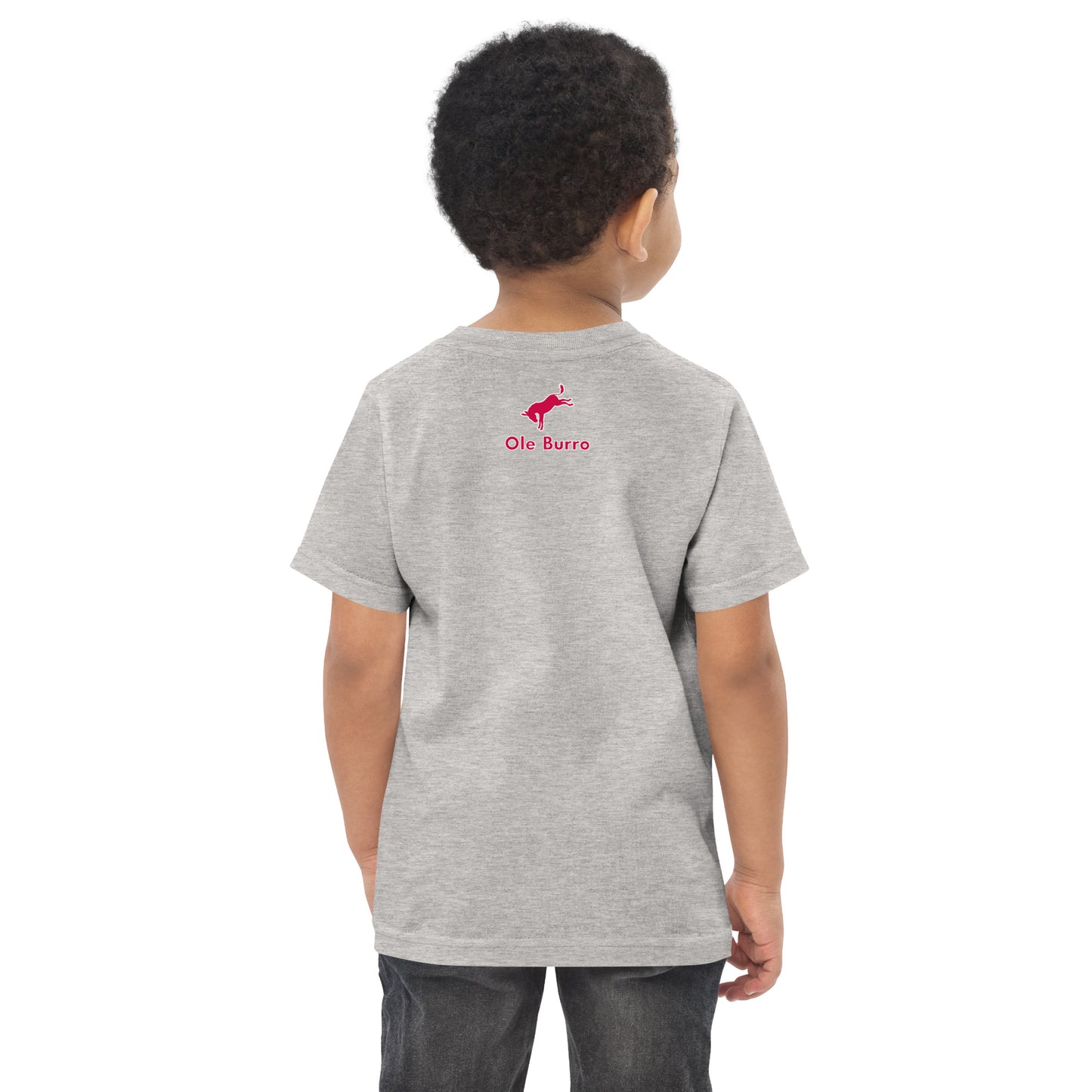 Child wearing a gray t-shirt with a red logo on the back, standing against a white background