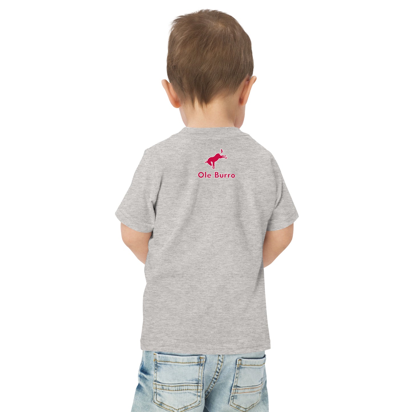Child wearing a gray t-shirt with a logo on the back, standing against a white background