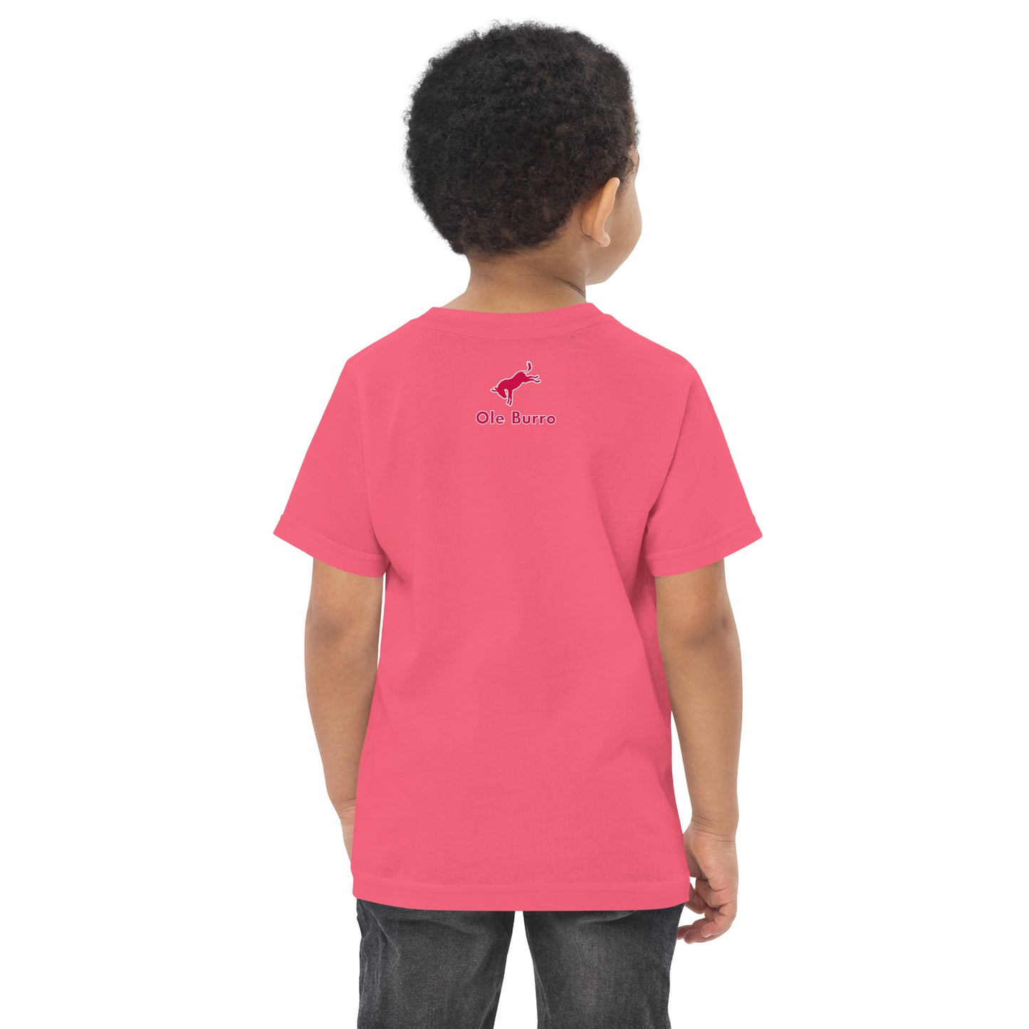 Child wearing a pink t-shirt with a logo on the back against a white background
