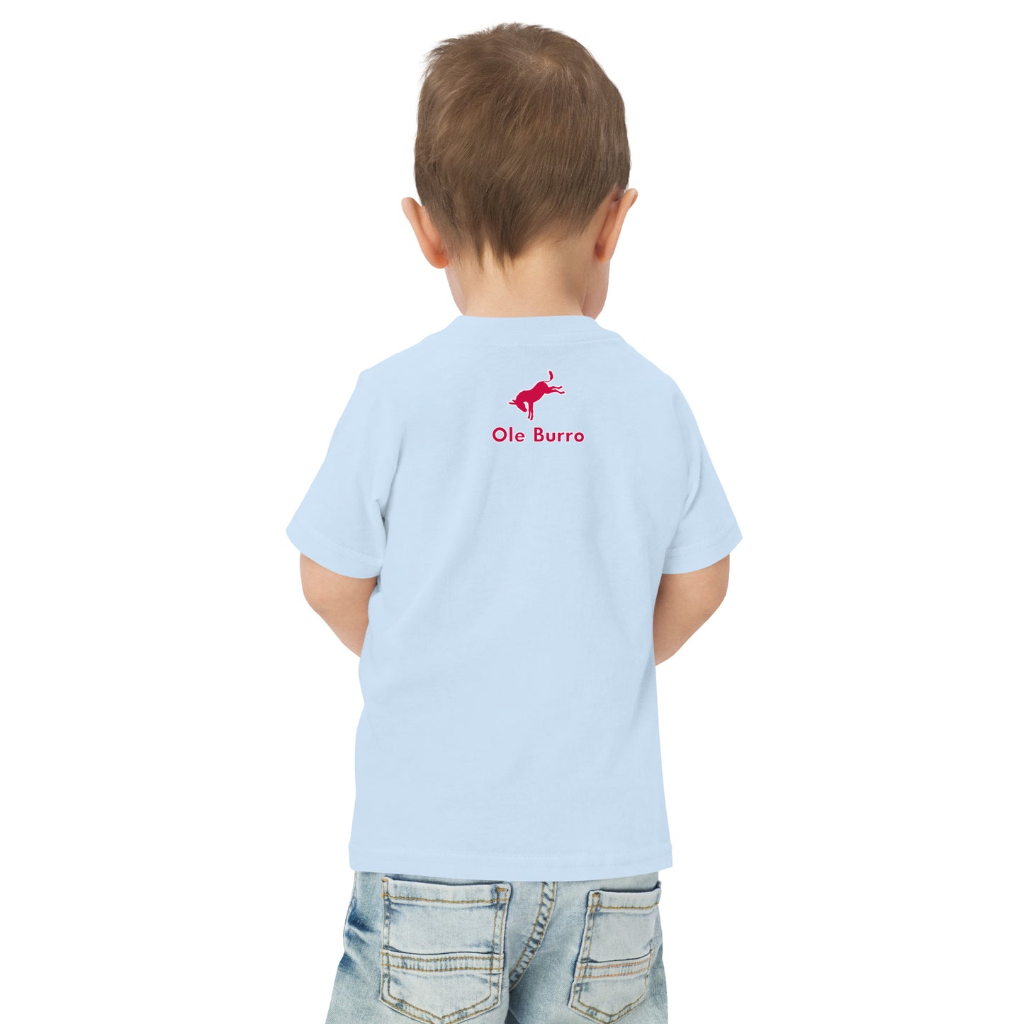Child wearing a light blue t-shirt with 'Ole Burro' logo on the back, standing against a white background.