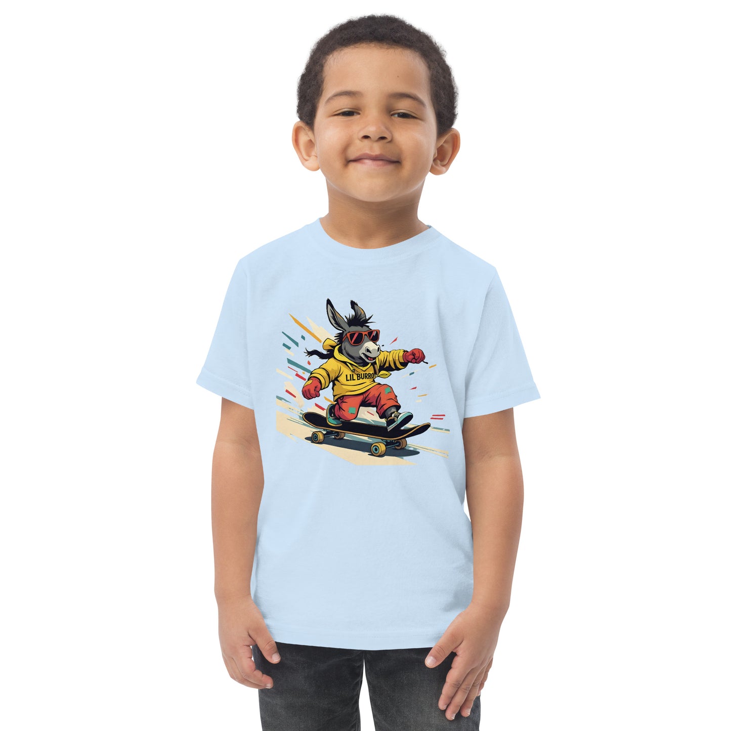 Child wearing a light blue t-shirt with a cartoon dog on a skateboard design.