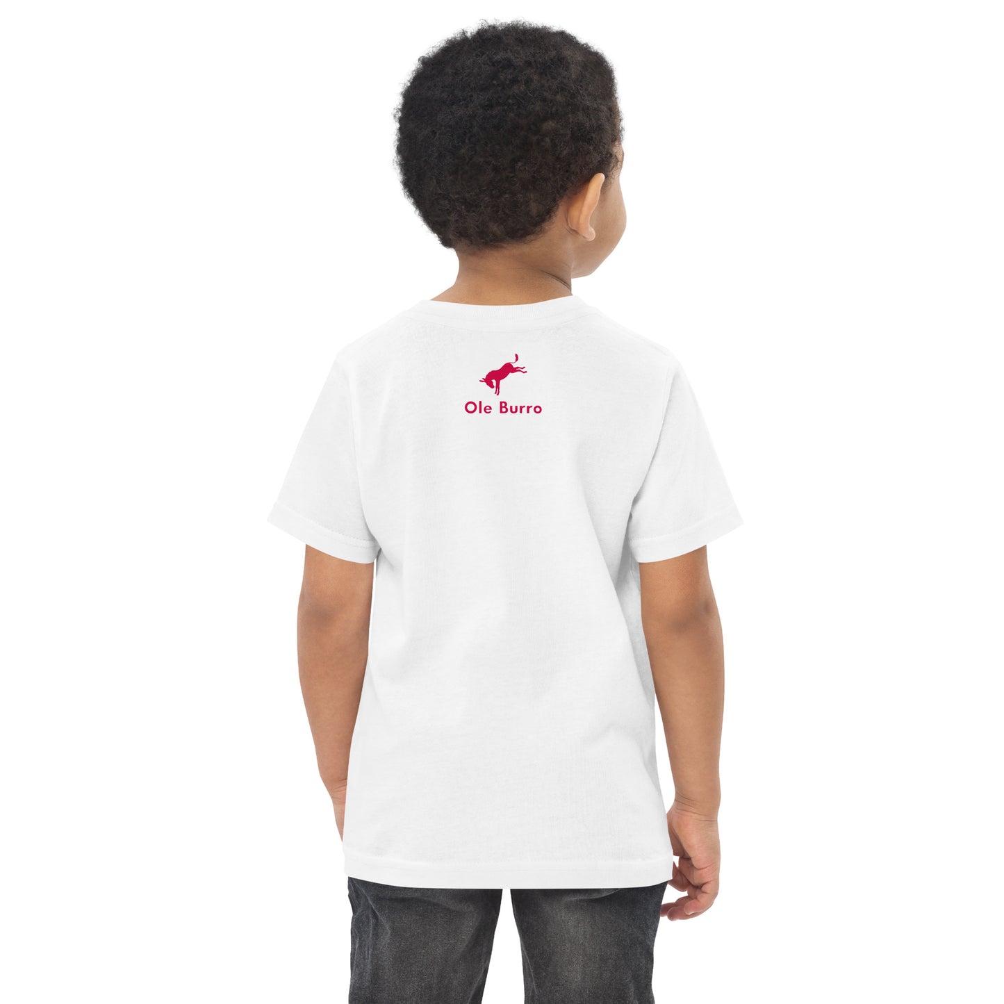 Child wearing a white t-shirt with a red logo on the back, standing against a white background