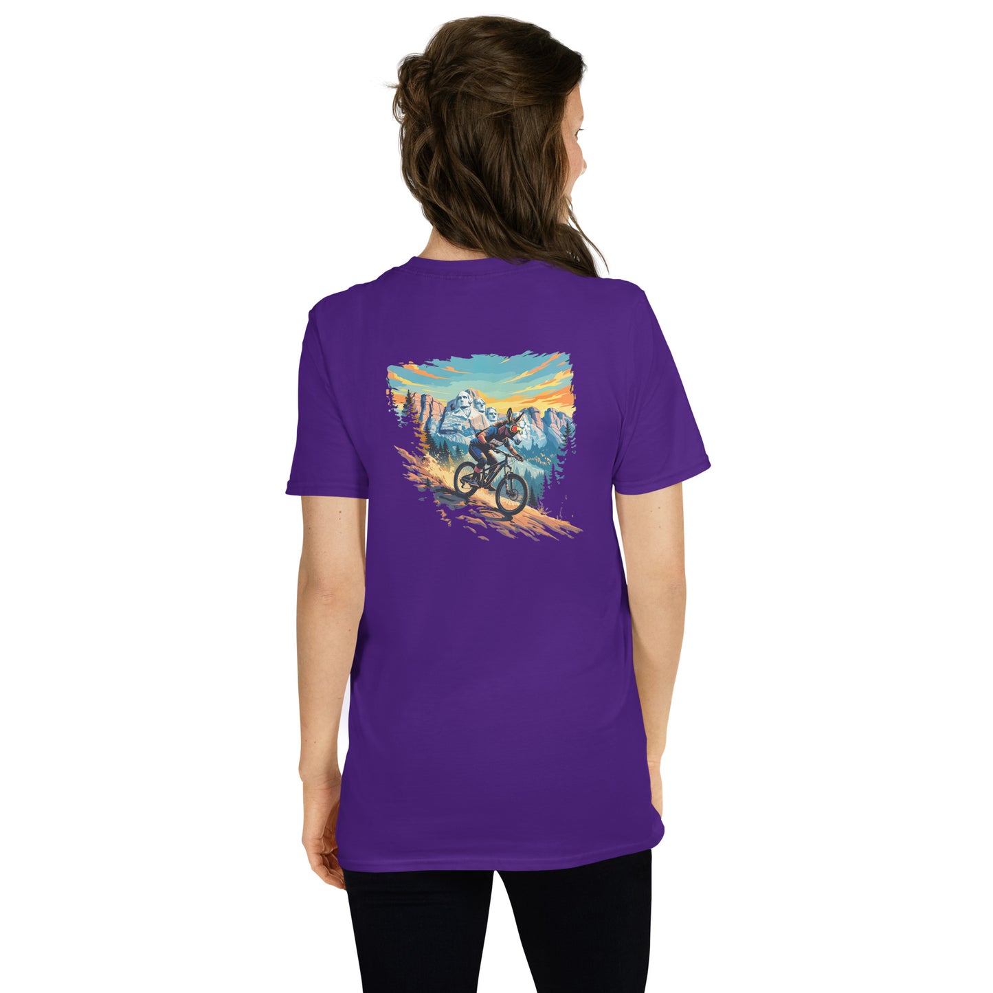 Person wearing a purple t-shirt with a graphic of a mountain and bike on the back