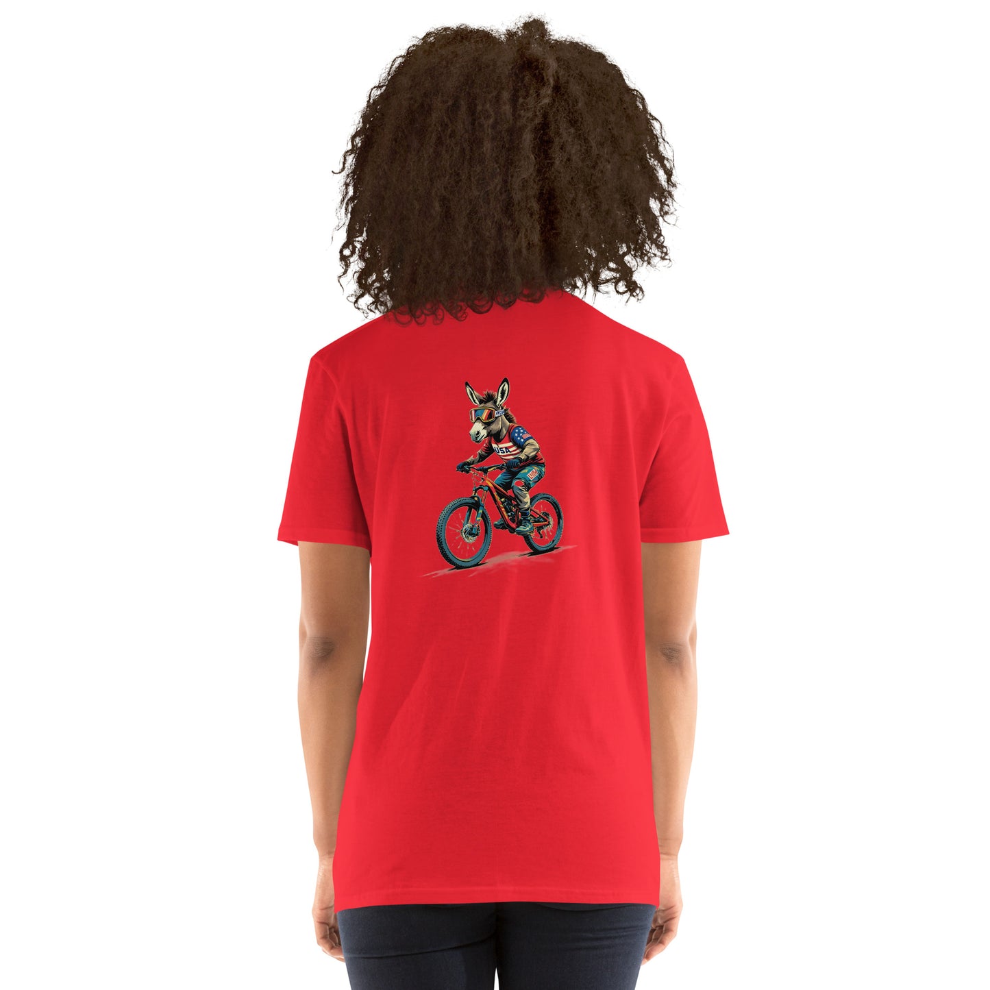 Person wearing a red t-shirt with a graphic of a dog riding a bike on the back, on a white background.