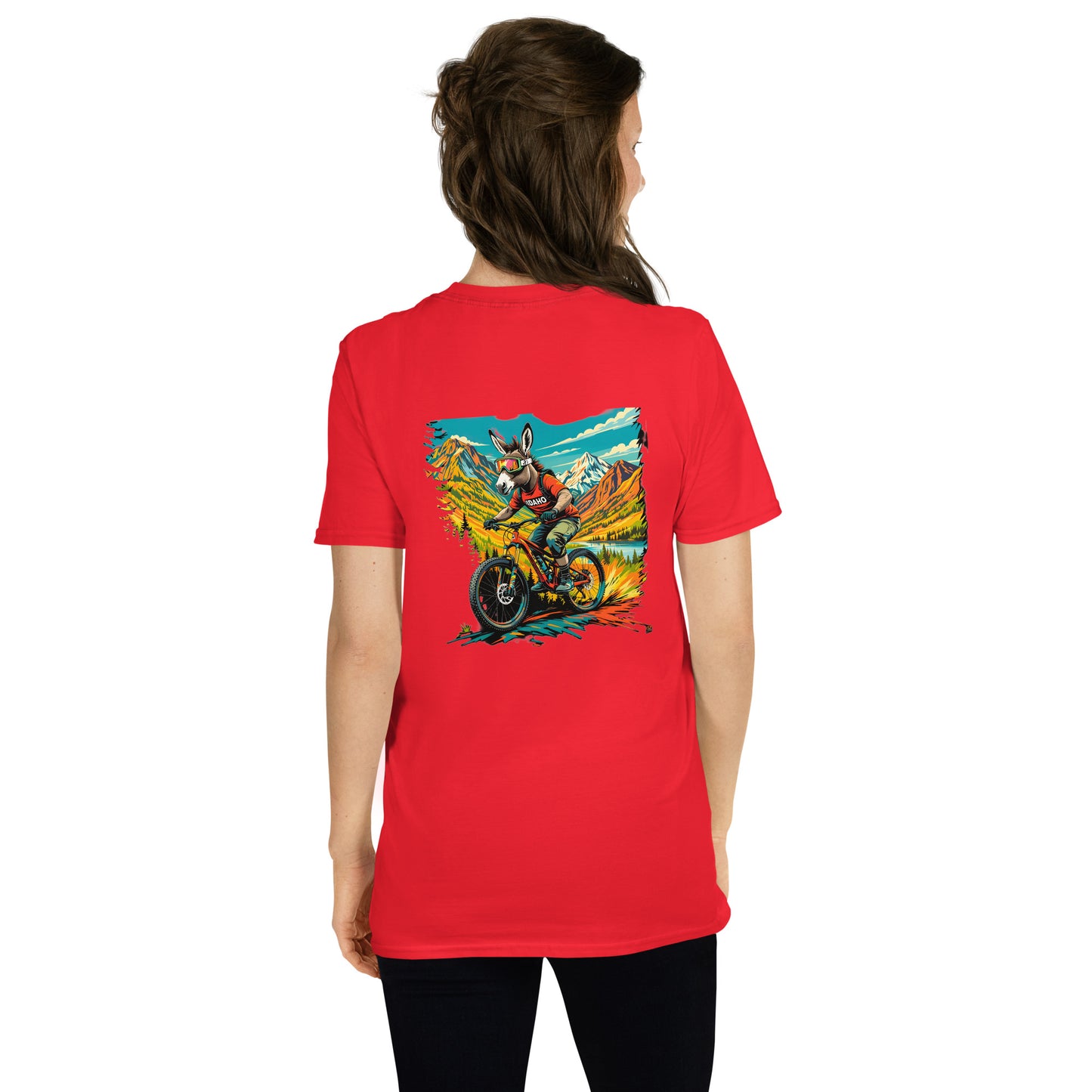 Person wearing a red t-shirt with a graphic design on the back, standing against a white background