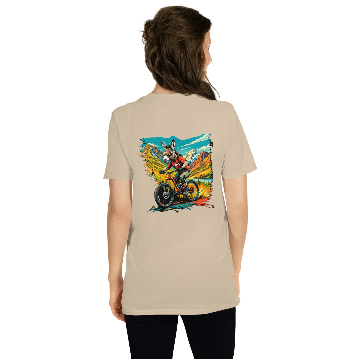 Person wearing a beige t-shirt with a colorful graphic on the back against a white background