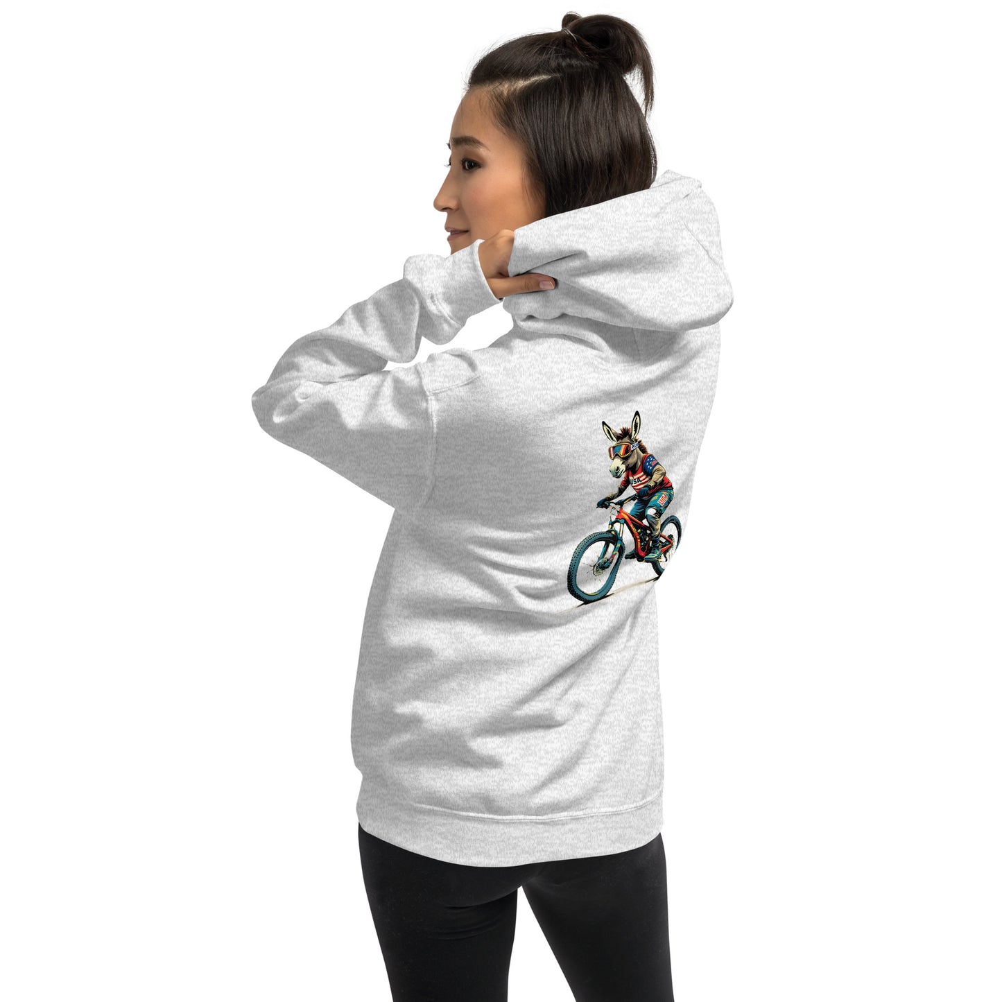 Person wearing a white hoodie with a graphic of a person on a bike and a dog.