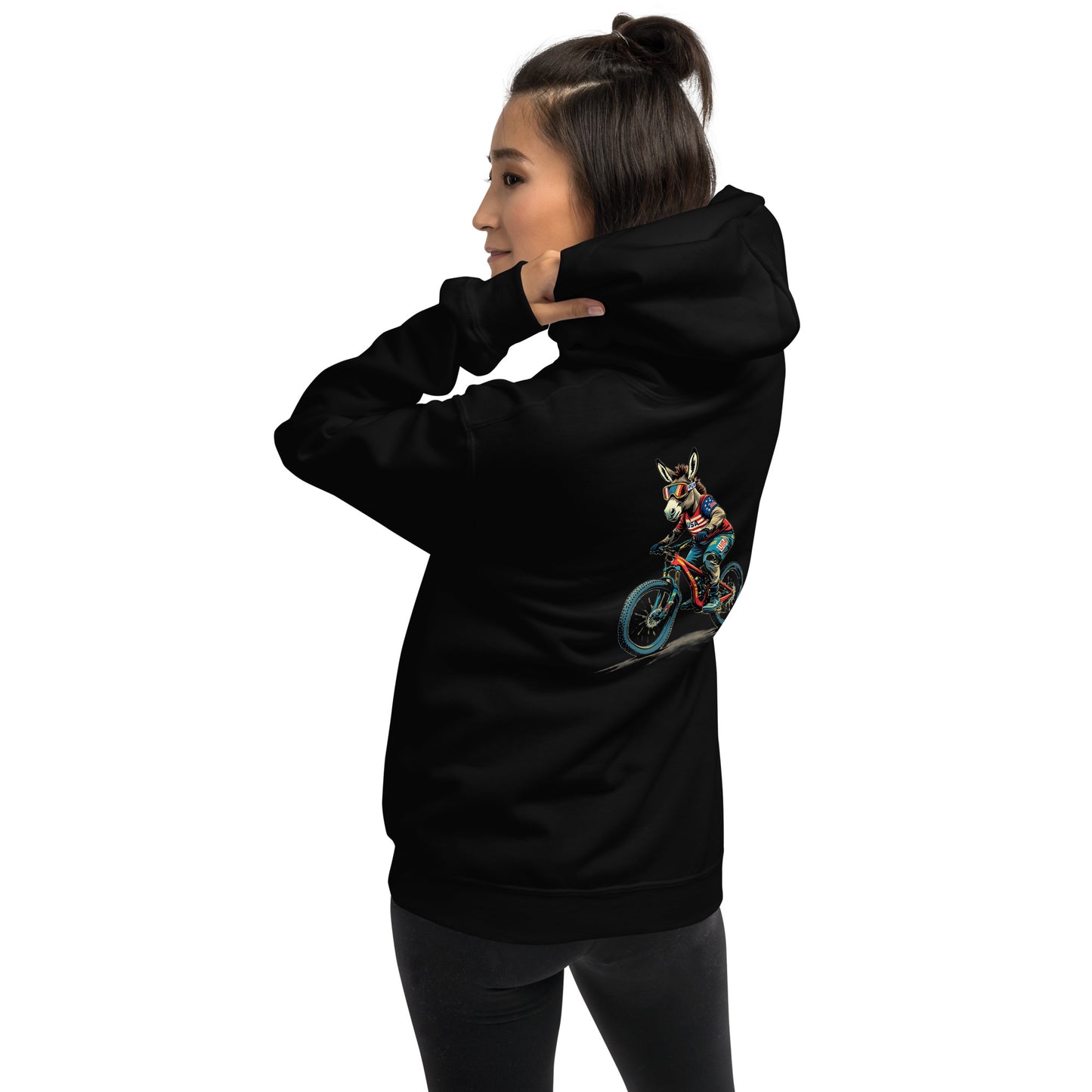 Person wearing a black hoodie with a colorful graphic on the back against a white background