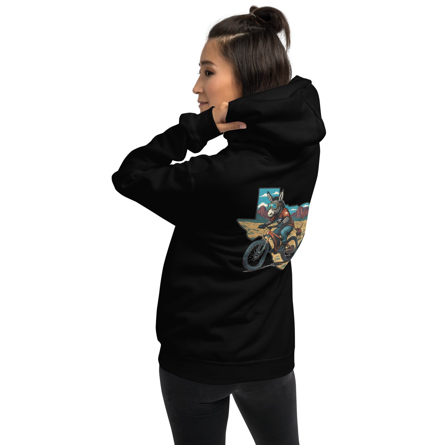Person wearing a black hoodie with a graphic design on the back against a white background
