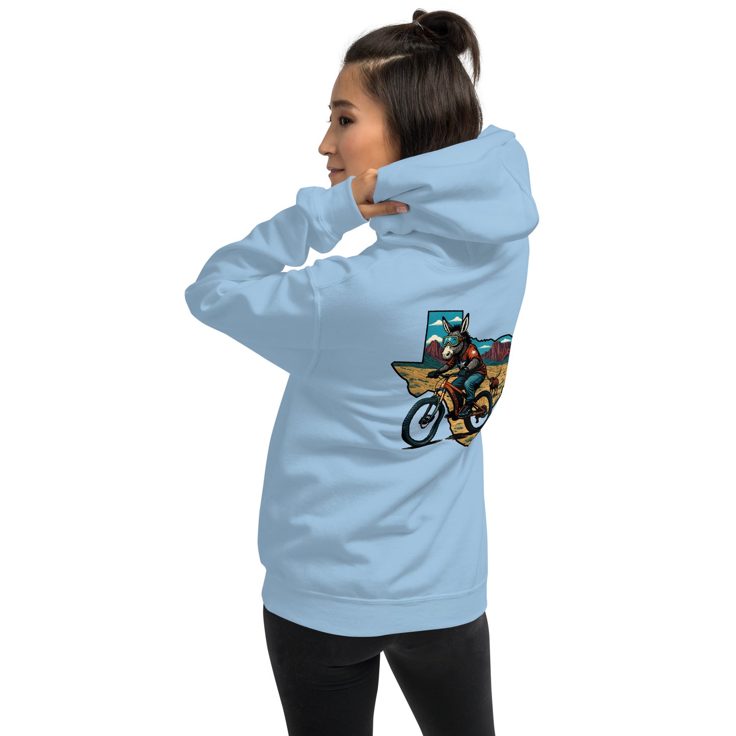 Light blue hoodie with a graphic design on the back, worn by a person.
