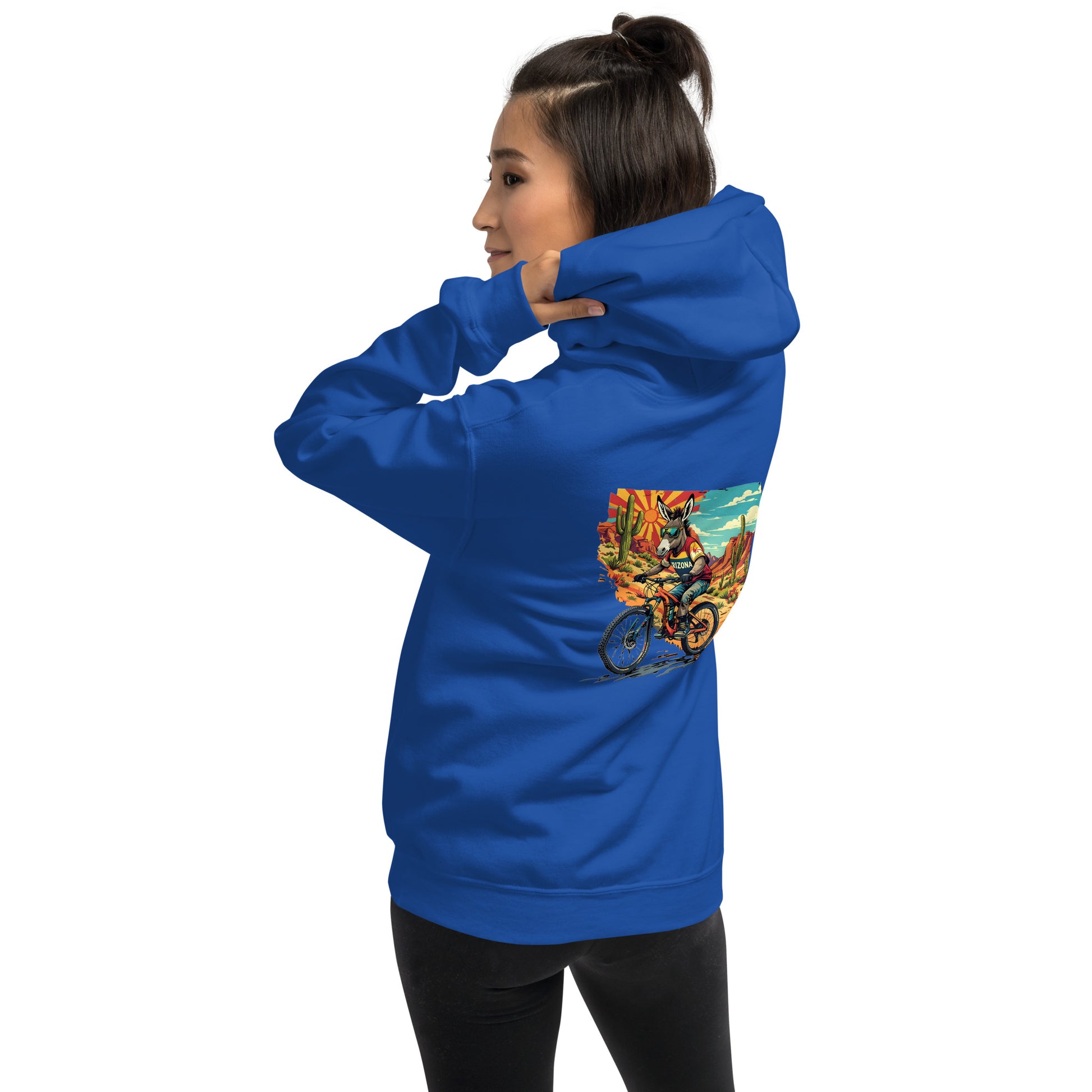 Person wearing a blue hoodie with a colorful graphic on the back against a white background