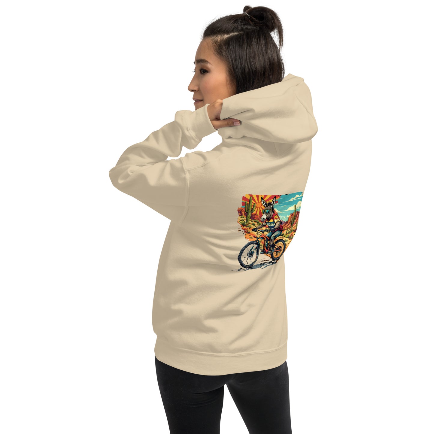 Person wearing a beige hoodie with a colorful graphic on the back