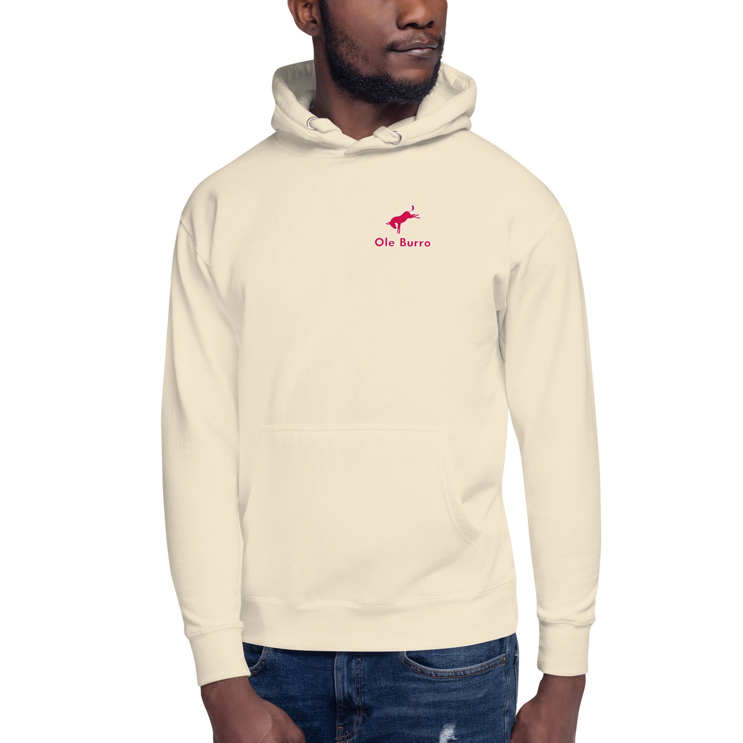 Man wearing a cream hoodie with a logo on a white background
