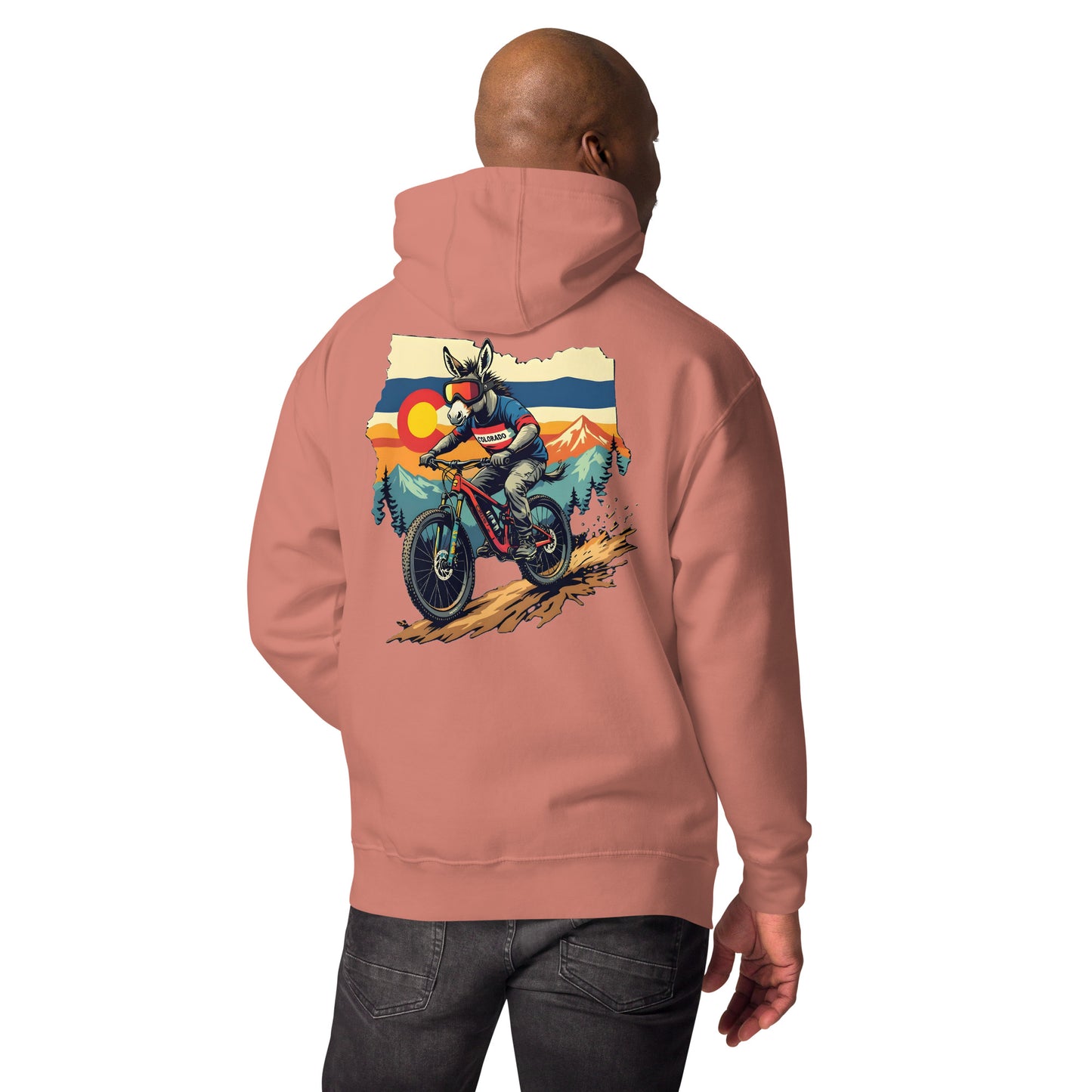 Person wearing a pink hoodie with a motorcycle graphic on the back against a white background