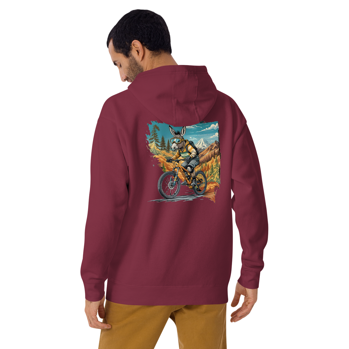 Person wearing a maroon hoodie with a colorful graphic on the back, standing against a white background