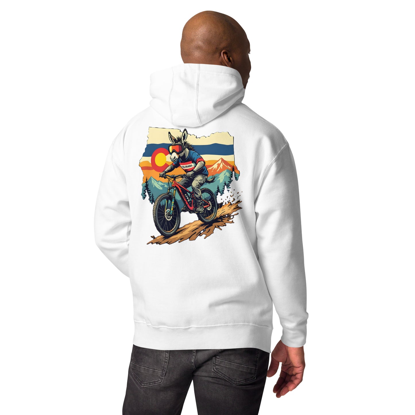 White hoodie with a graphic of a person on a motorcycle in the mountains on the back, worn by a person.