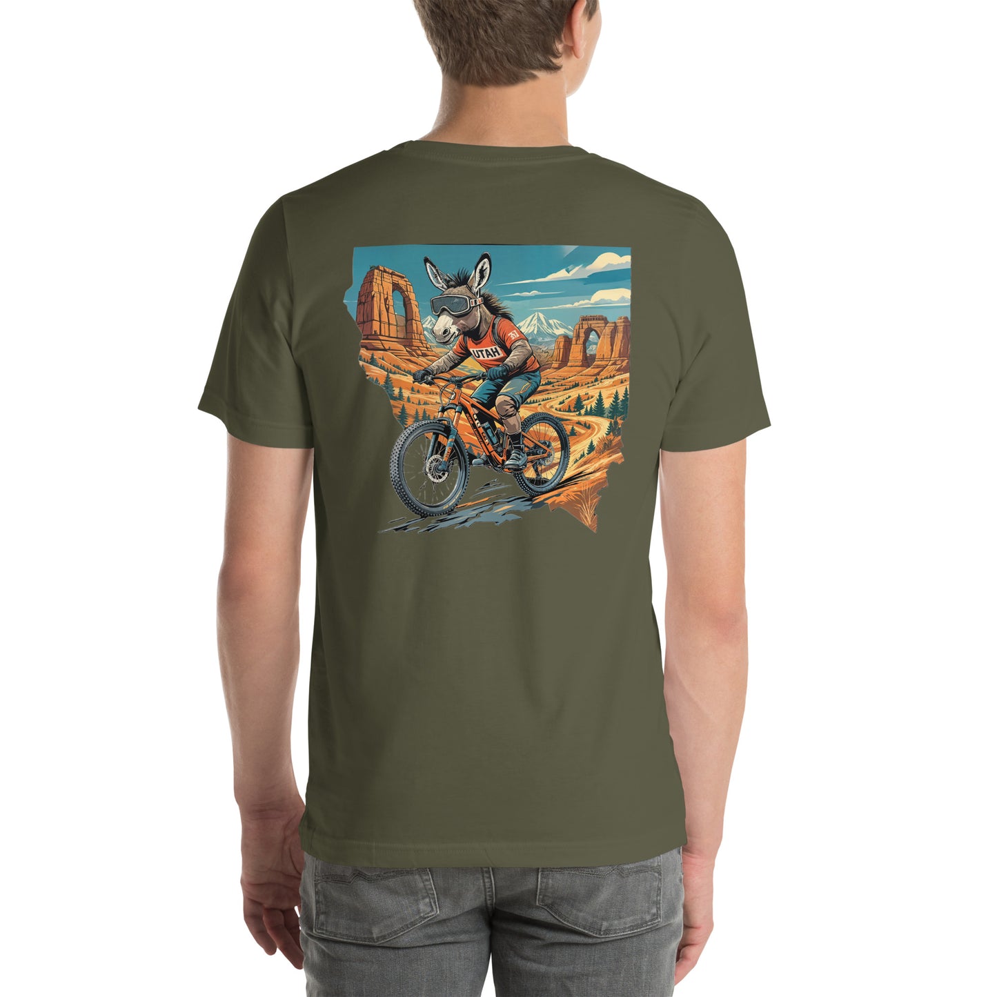 Person wearing a green t-shirt with a graphic of a donkey riding a bike in a desert landscape.