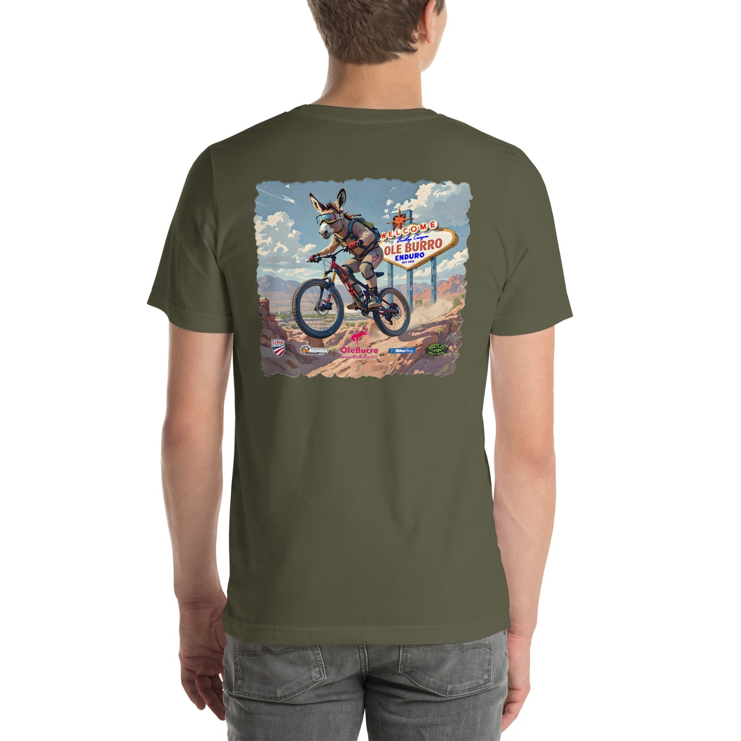 Person wearing a green t-shirt with a graphic design on the back, featuring a donkey on a bike and a sign.