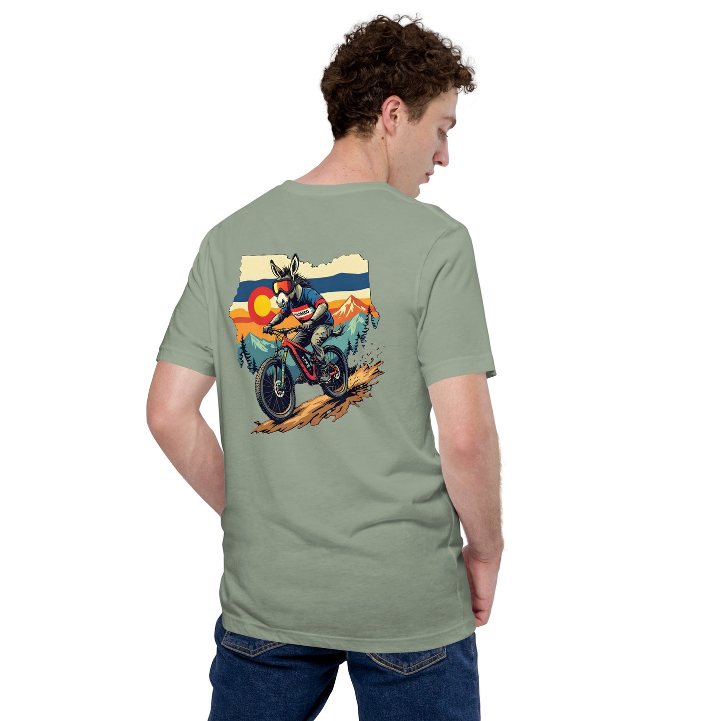 Person wearing a green t-shirt with a colorful graphic on the back, standing against a white background