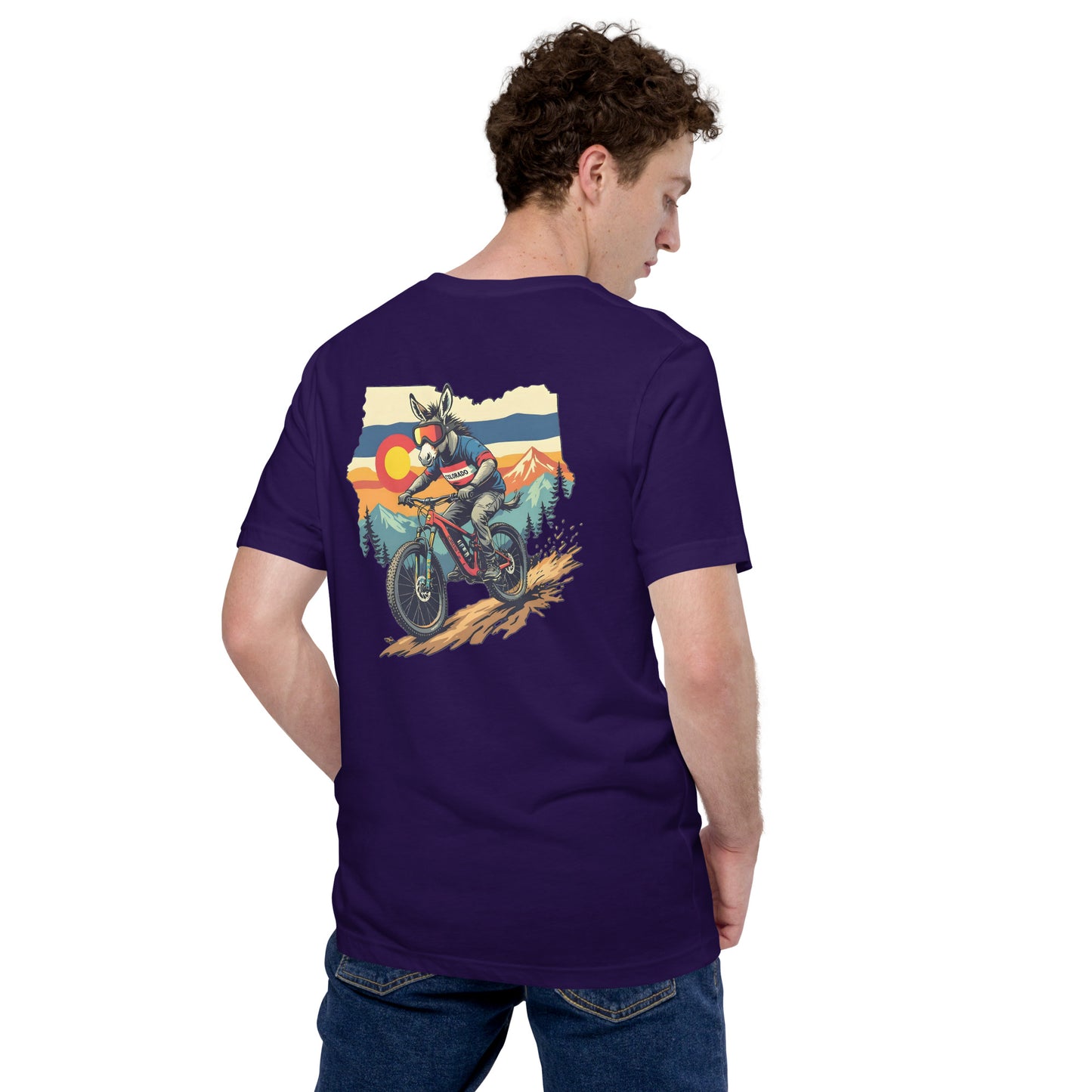 Person wearing a purple t-shirt with a graphic of a motorcycle on the back, standing against a white background.