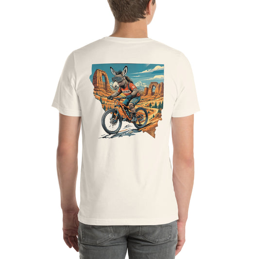 Person wearing a t-shirt with a graphic of a donkey riding a bike in a desert landscape.