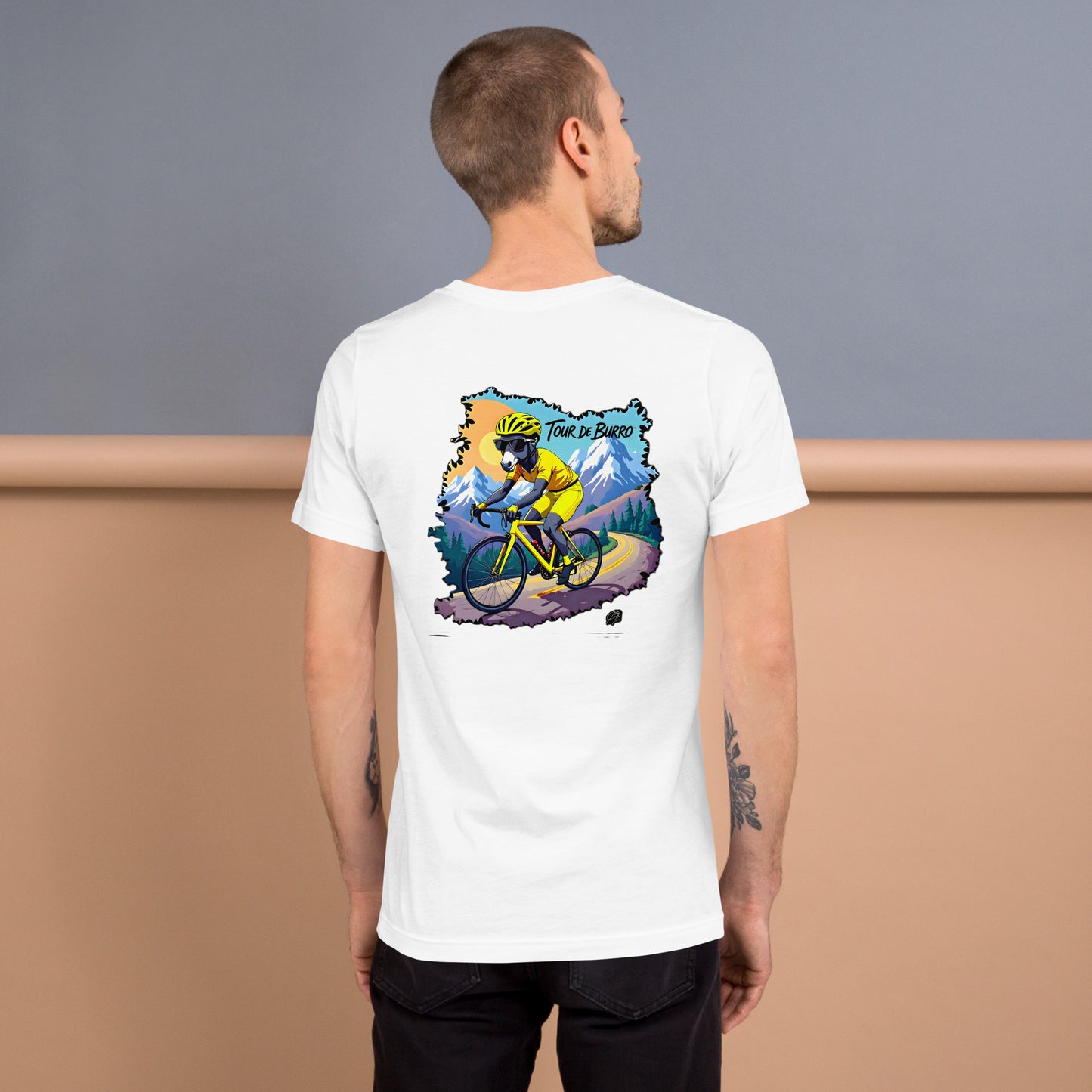 Man wearing a white t-shirt with a colorful graphic on the back, standing against a gradient background.