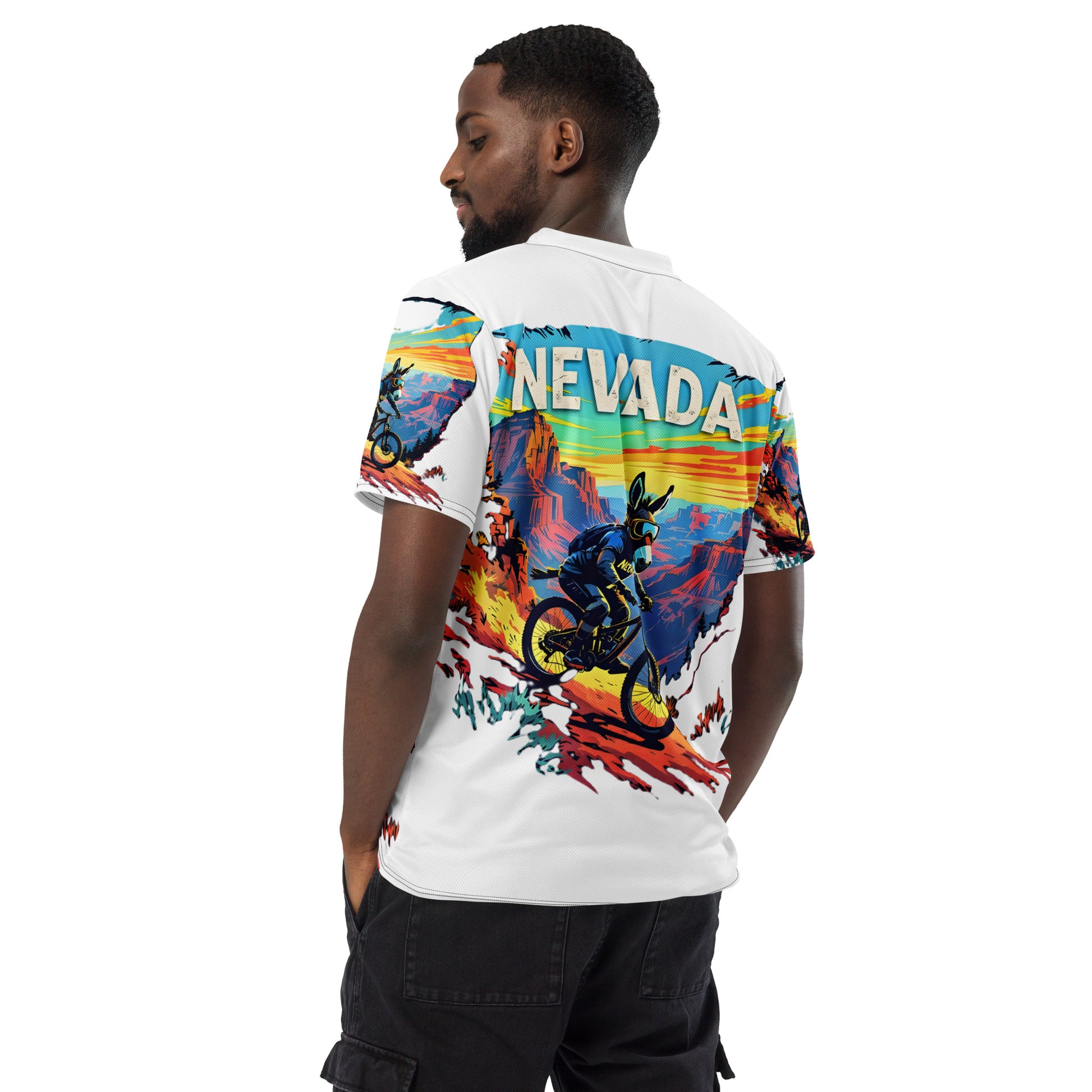 Man wearing a colorful shirt with 'NEVADA' text and graphic design on a white background