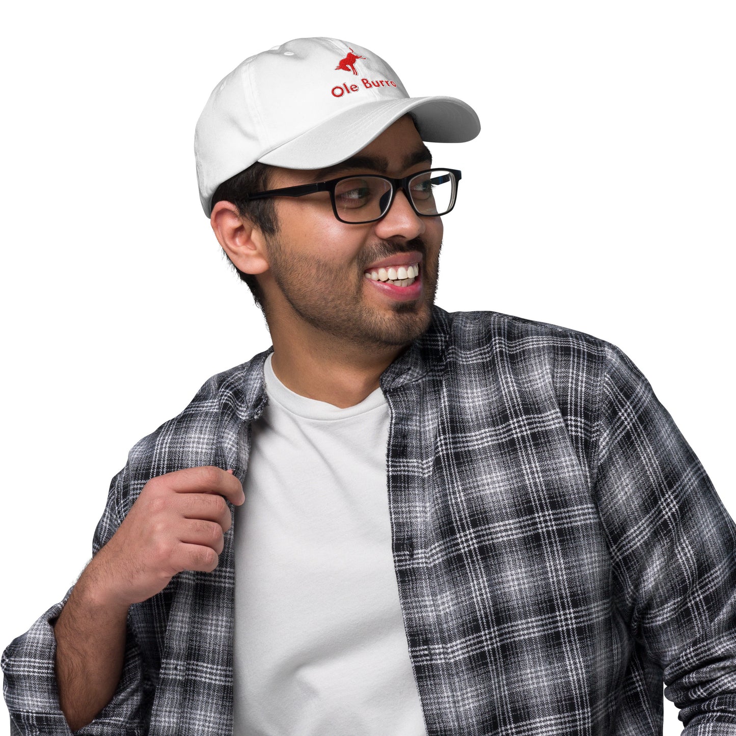 Man wearing a white cap with a logo, glasses, and a plaid shirt on a white background