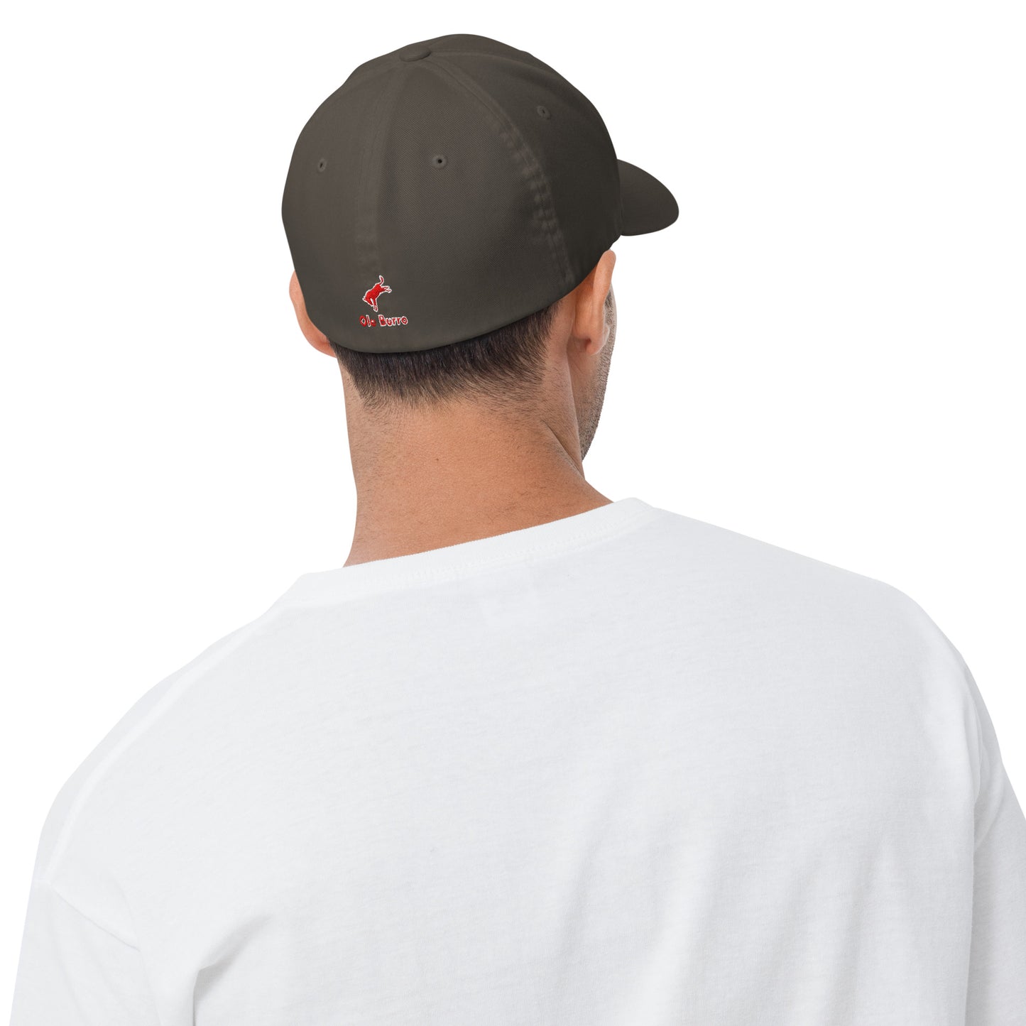 Person wearing a dark green cap with a logo on the back, white shirt visible