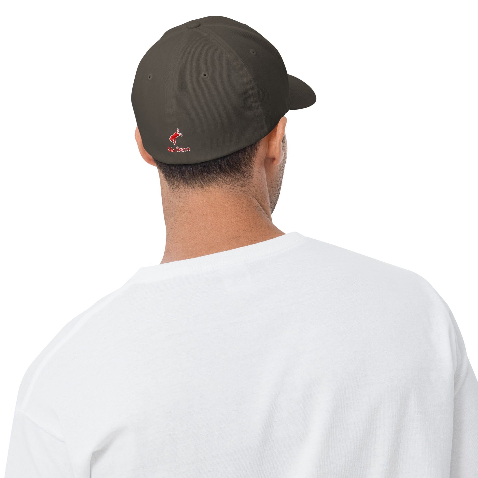 Person wearing a dark green cap with a logo on the back, white shirt visible