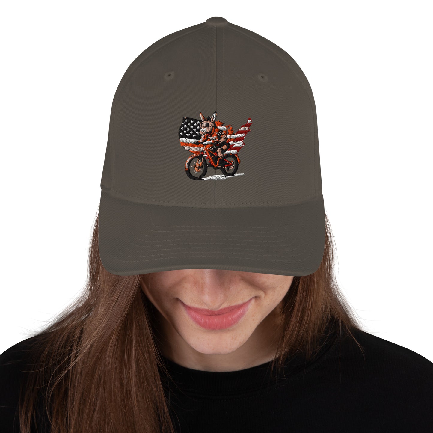 Person wearing a cap with a motorcycle and American flag design on a white background