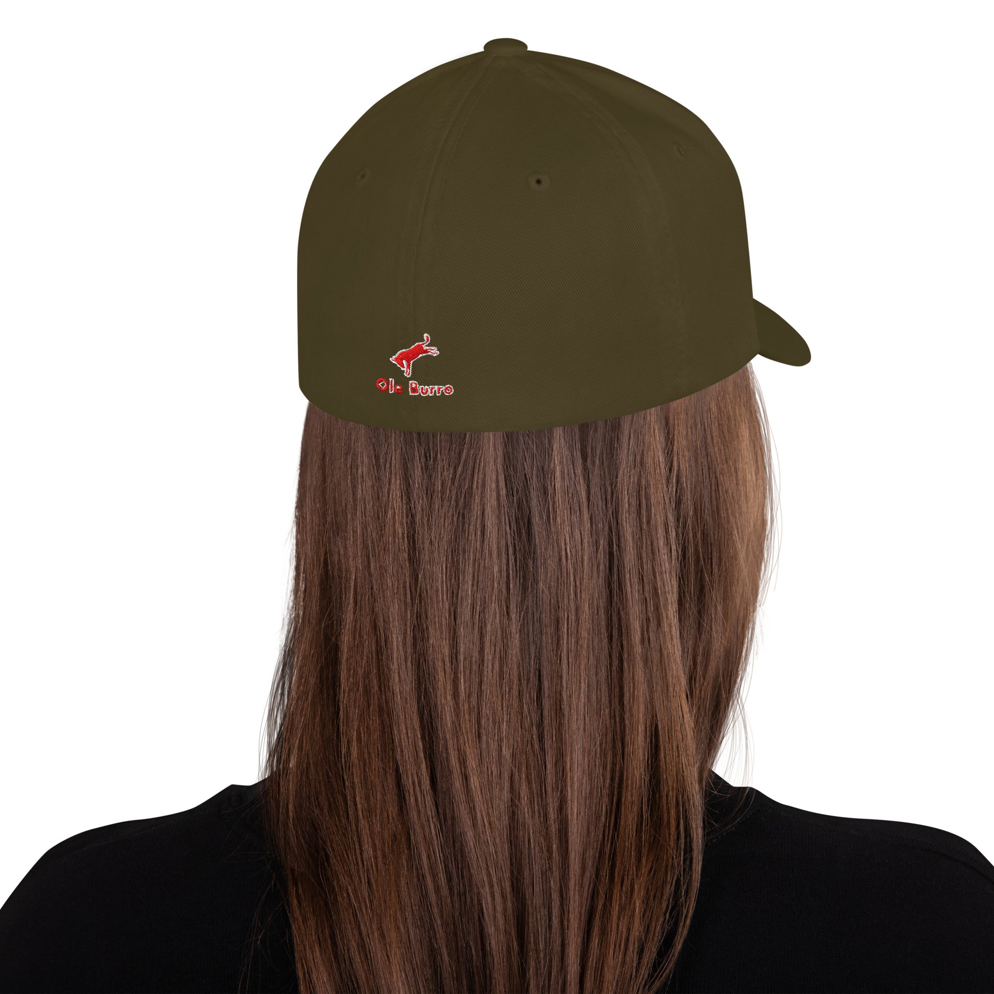 Person wearing a dark green cap with a logo on a white background