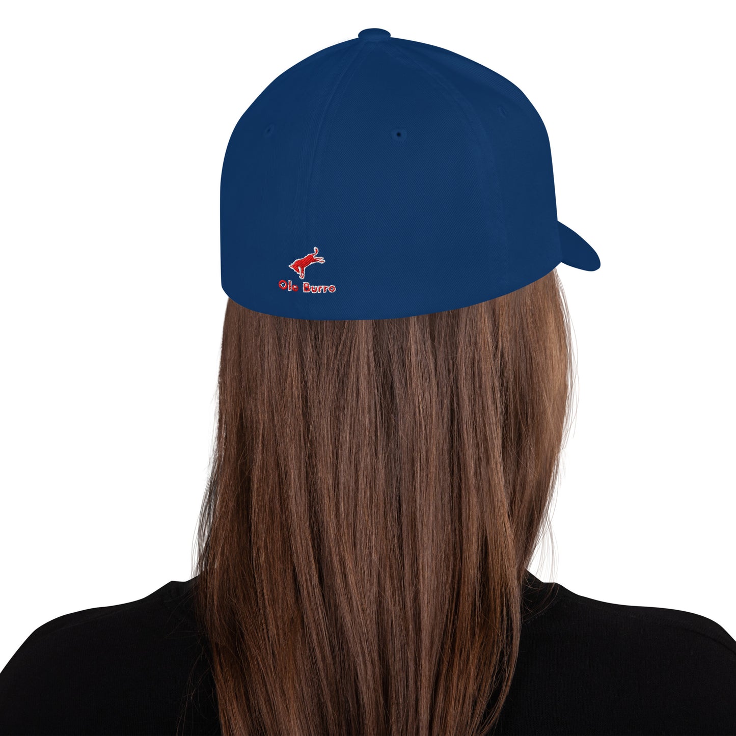 Blue cap with a logo worn by a person with long brown hair on a white background