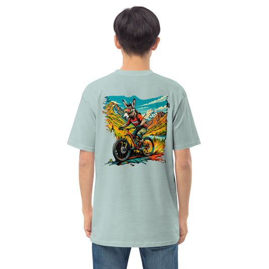 Person wearing a light blue t-shirt with a colorful graphic on the back, standing against a white background.