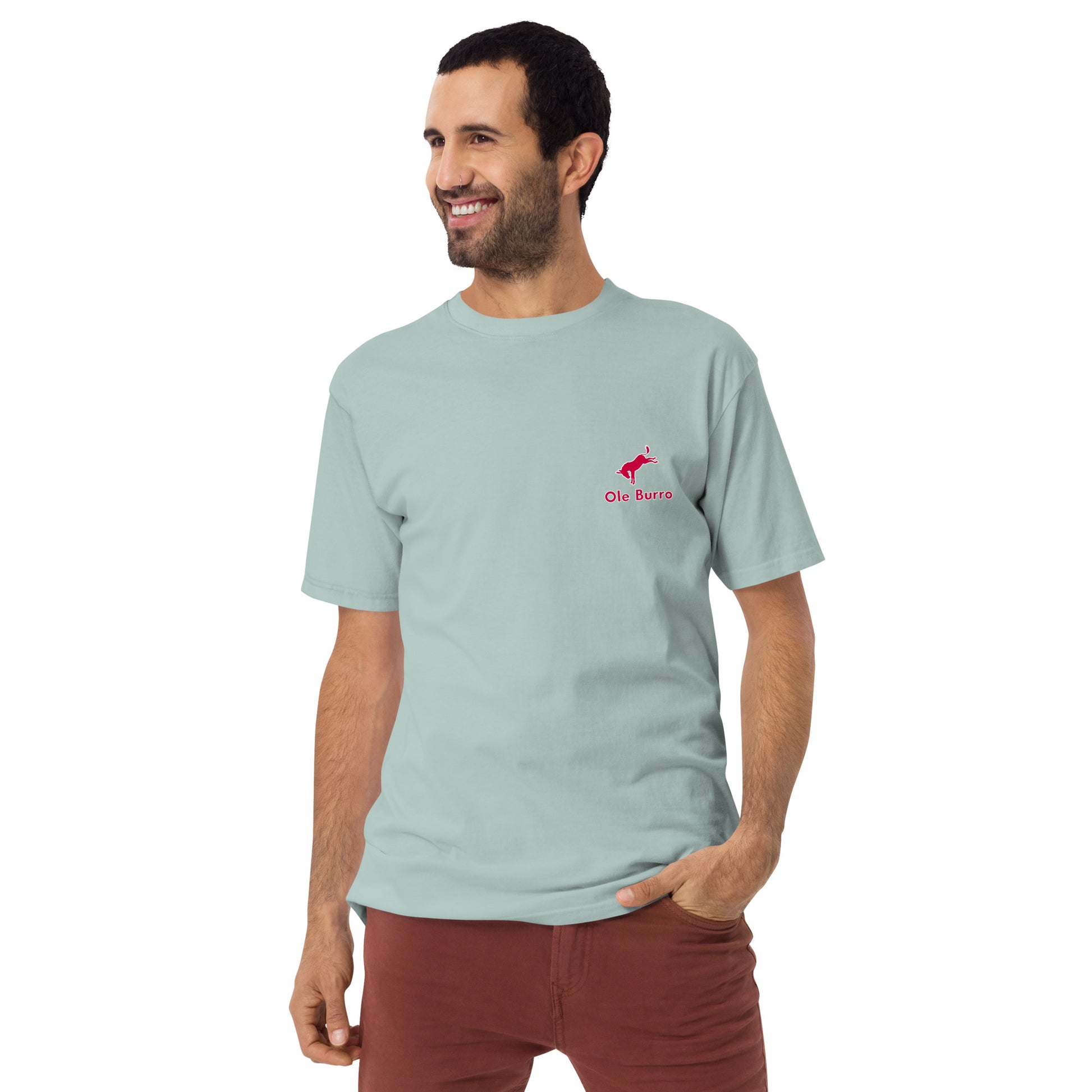 Man wearing a light blue t-shirt with a red logo on a white background