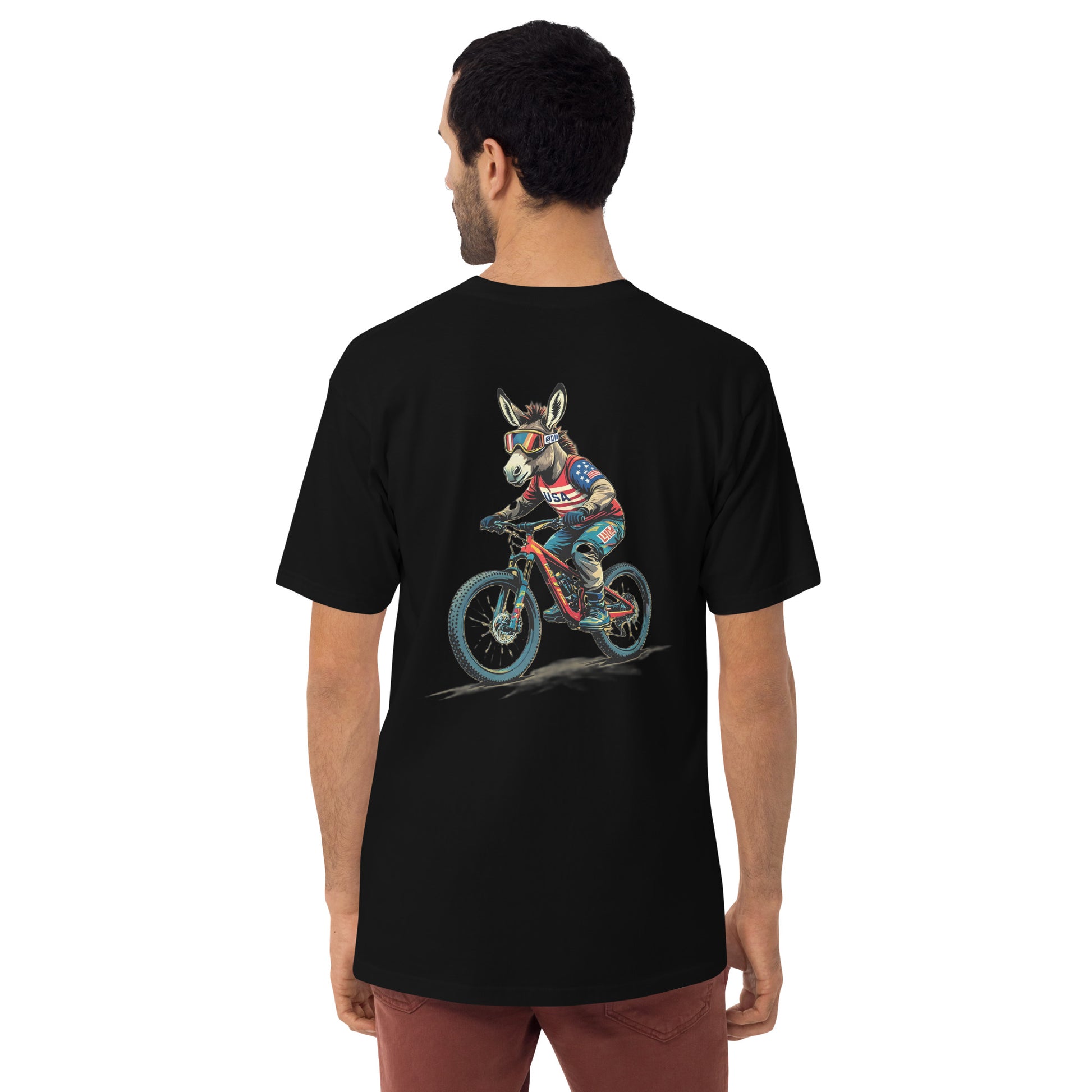 Person wearing a black t-shirt with a donkey riding a bicycle graphic on the back.