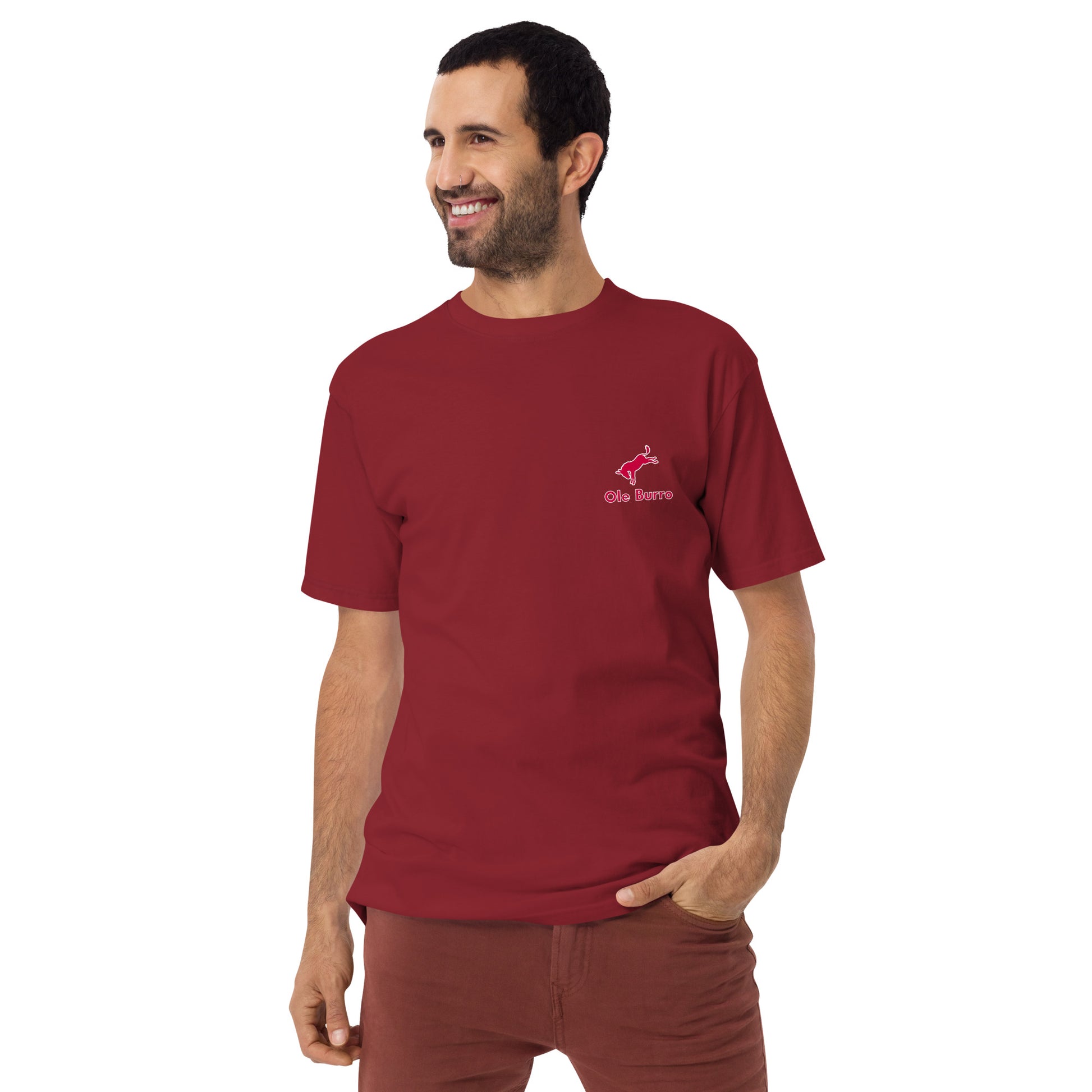 Man wearing a red t-shirt with a logo on a white background
